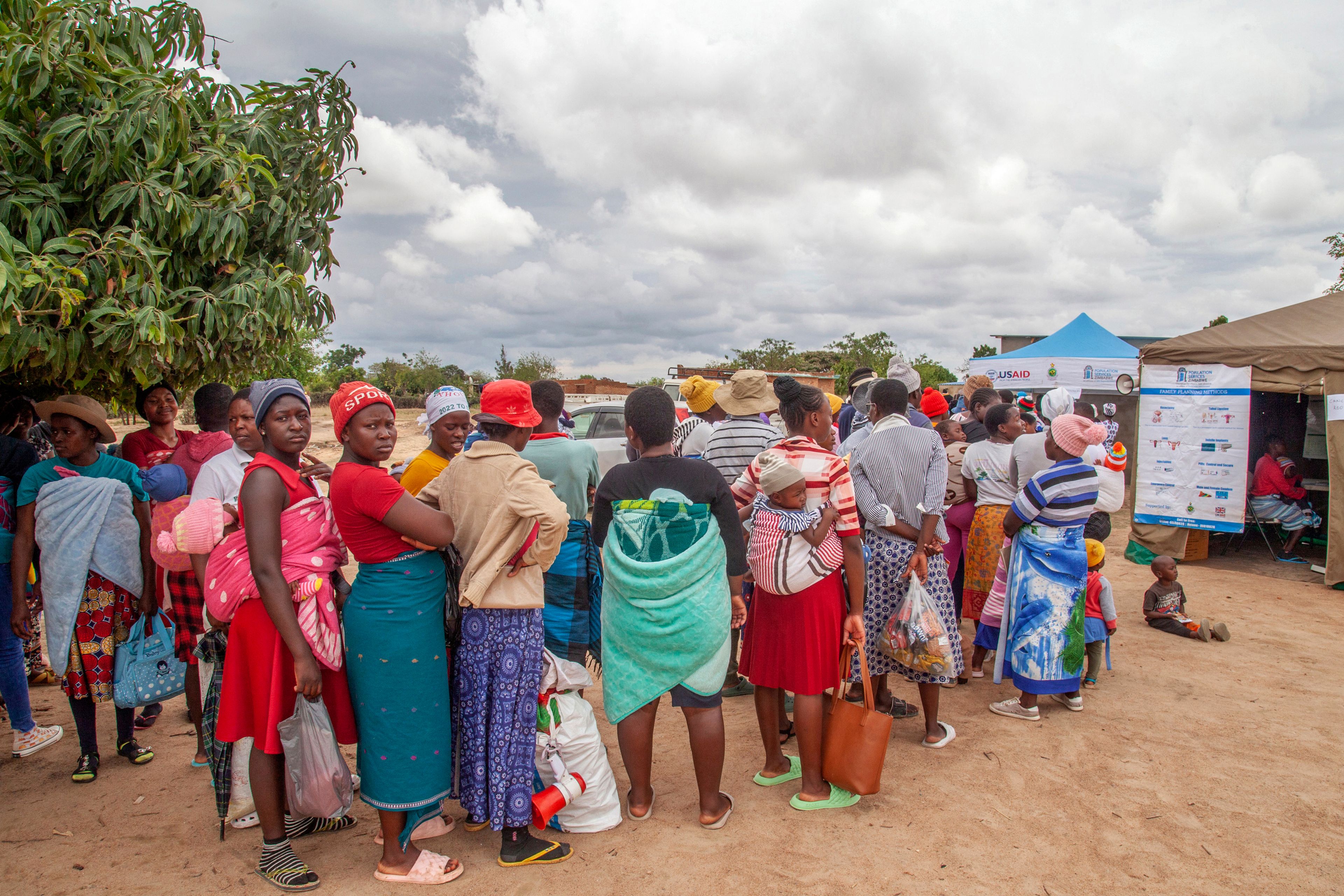 Women attend an outtreach clinic in Epworth, Zimbabwe, Thursday, Nov. 14, 2024. (AP Photo/Aaron Ufumeli)