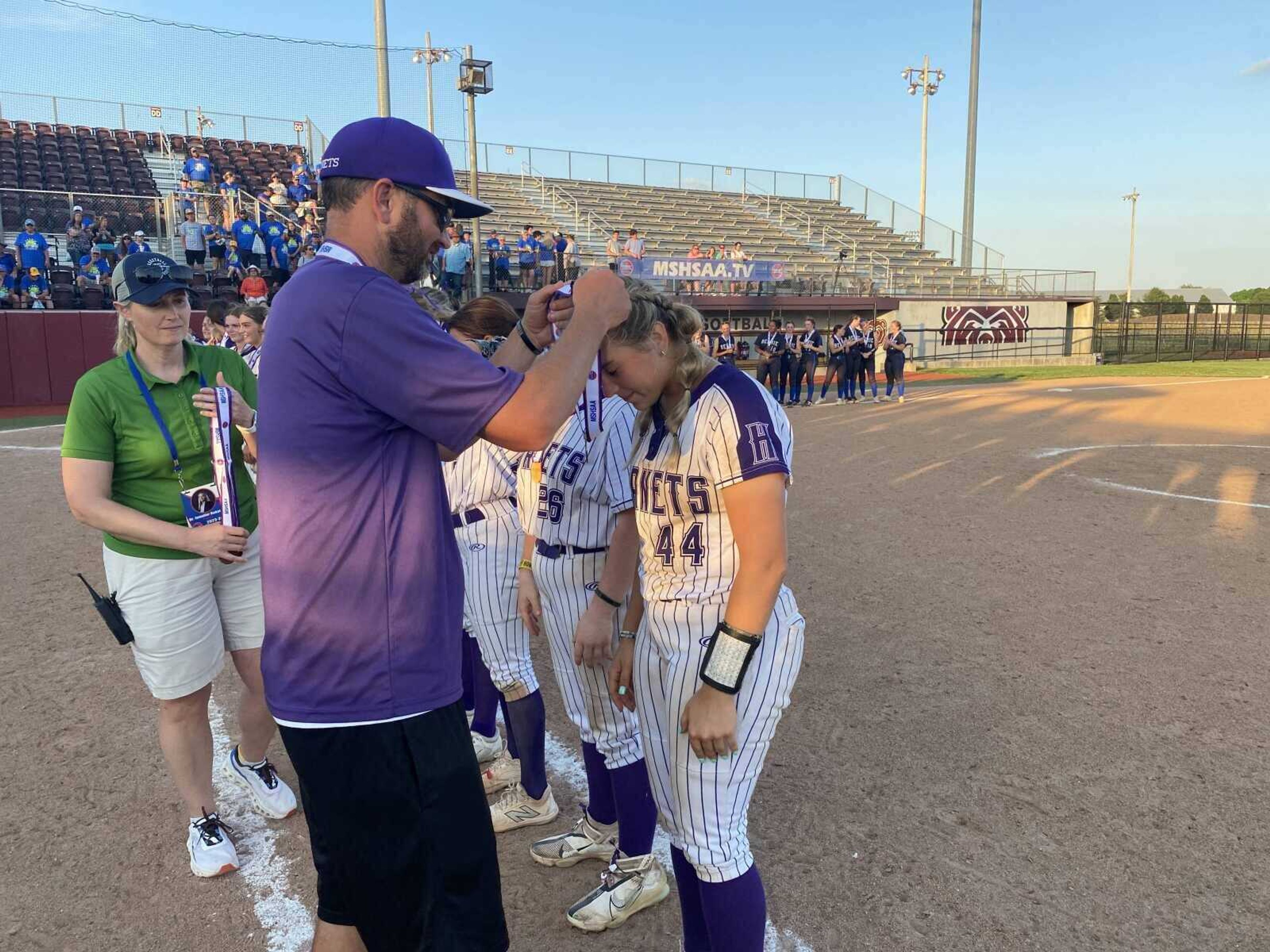 Holcomb Lady Hornets' Tri-County Coach of the Year Matt Casper awards bronze to Tri-County Conference Player of the Year Maleigh Lemings at the MSHSAA Class 1 State Semifinal game at Springfield.