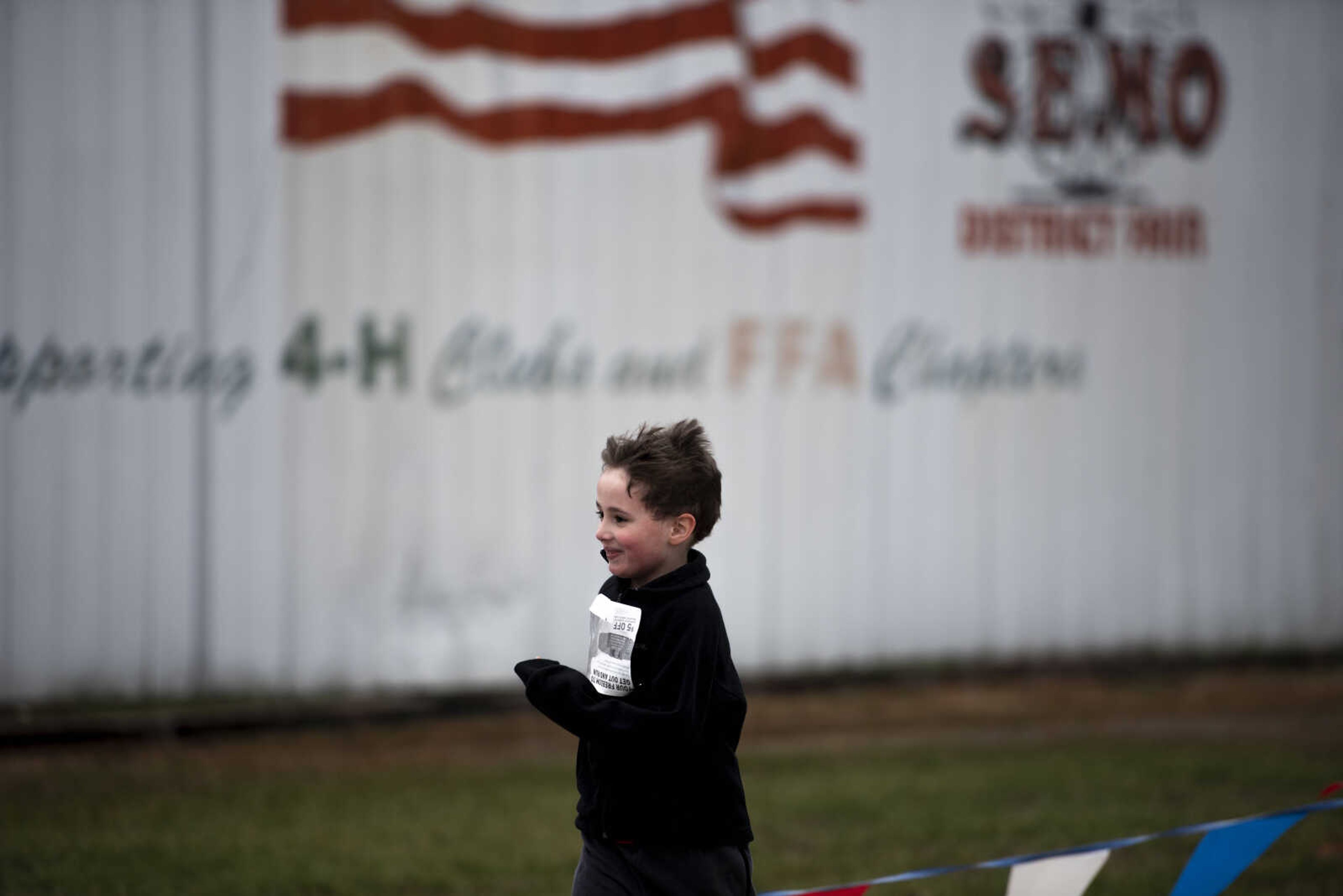 Gavin Ryan, 6, takes off in a sprint toward the finish line of the Resolution Challenge at Arena Park Tuesday, Jan. 1, 2019, in Cape Girardeau.