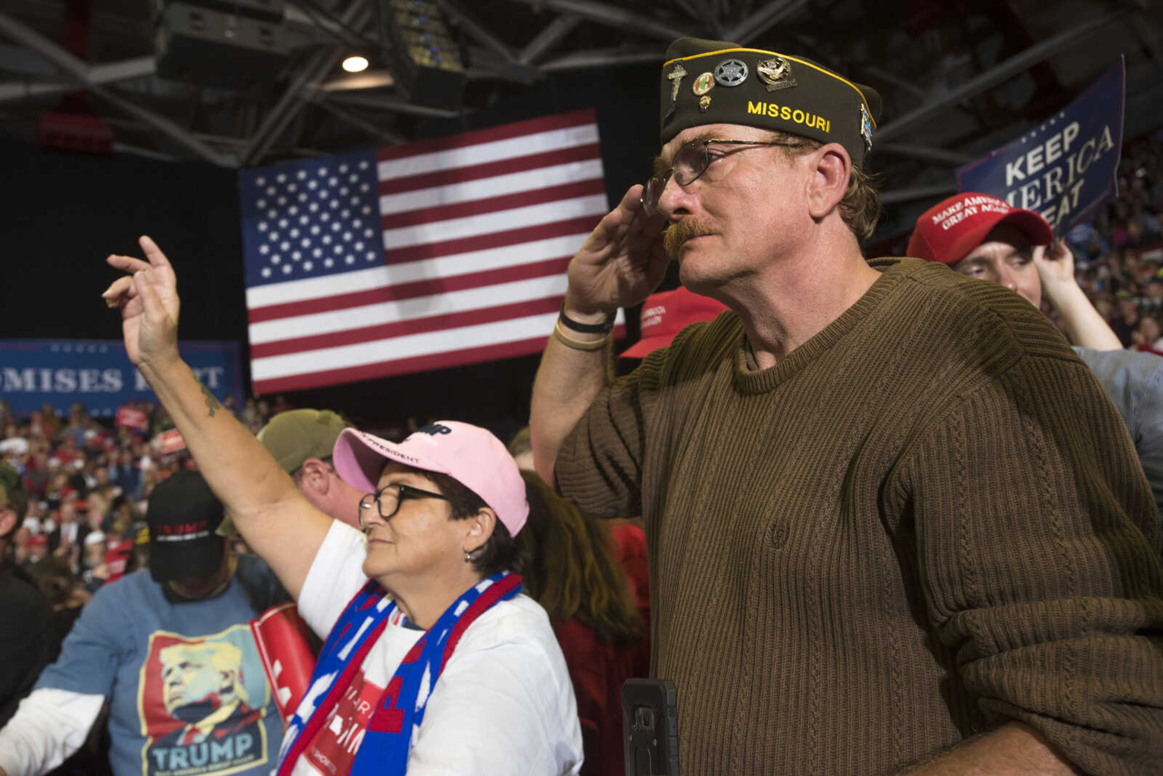 Ken Barten, right, salutes President Donald Trump as he takes the stage during a Make America Great Again rally Monday, Nov. 5, 2018, at the Show Me Center in Cape Girardeau.