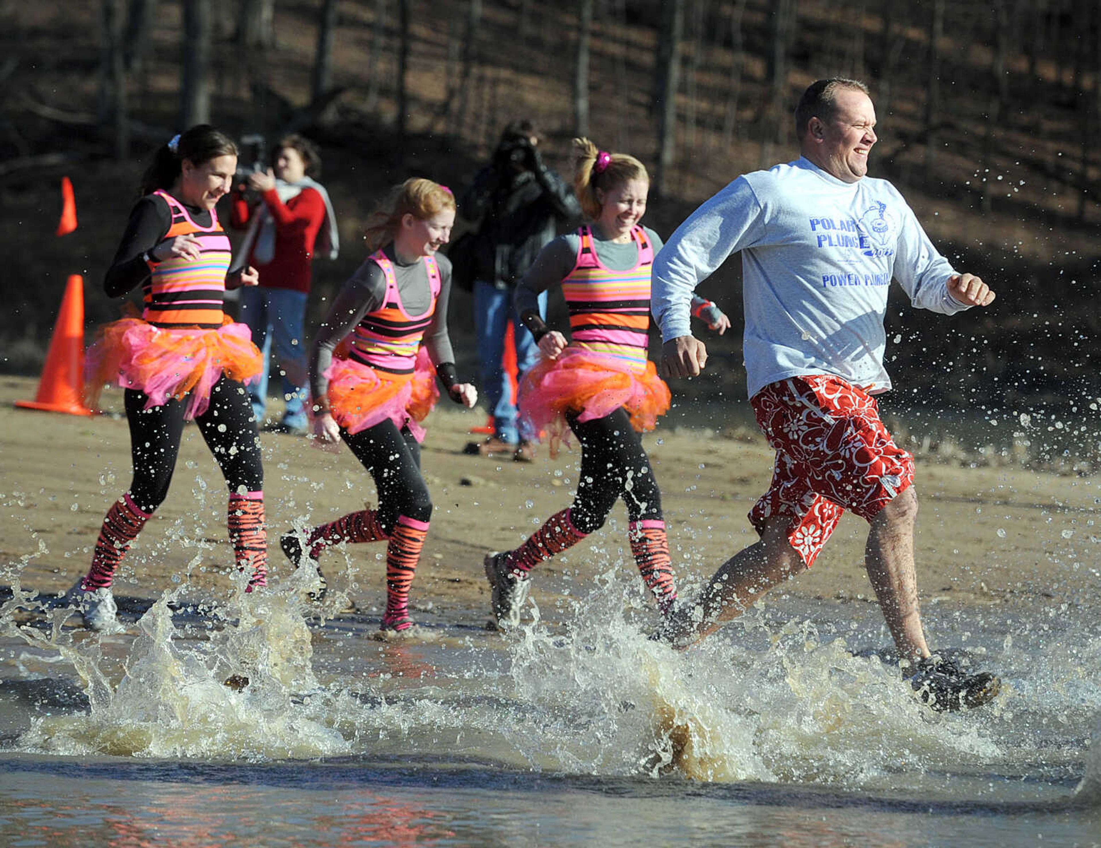 LAURA SIMON ~ lsimon@semissourian.com
People plunge into the cold waters of Lake Boutin Saturday afternoon, Feb. 2, 2013 during the Polar Plunge at Trail of Tears State Park. Thirty-six teams totaling 291 people took the annual plunge that benefits Special Olympics Missouri.