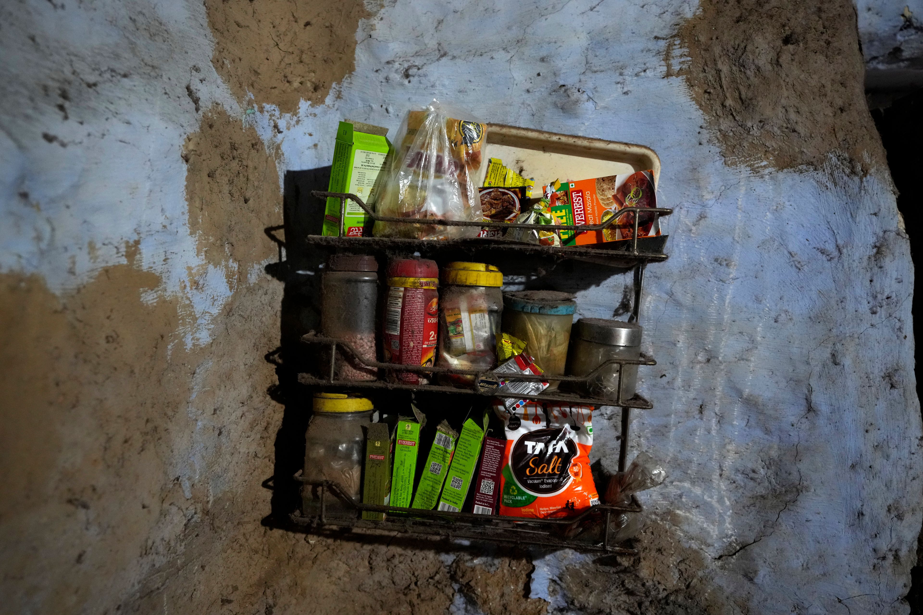 Tata salt is kept in a wall shelf among other spices in a kitchen in Prayagraj, India, Thursday, Oct. 10, 2024. (AP Photo/Rajesh Kumar Singh)