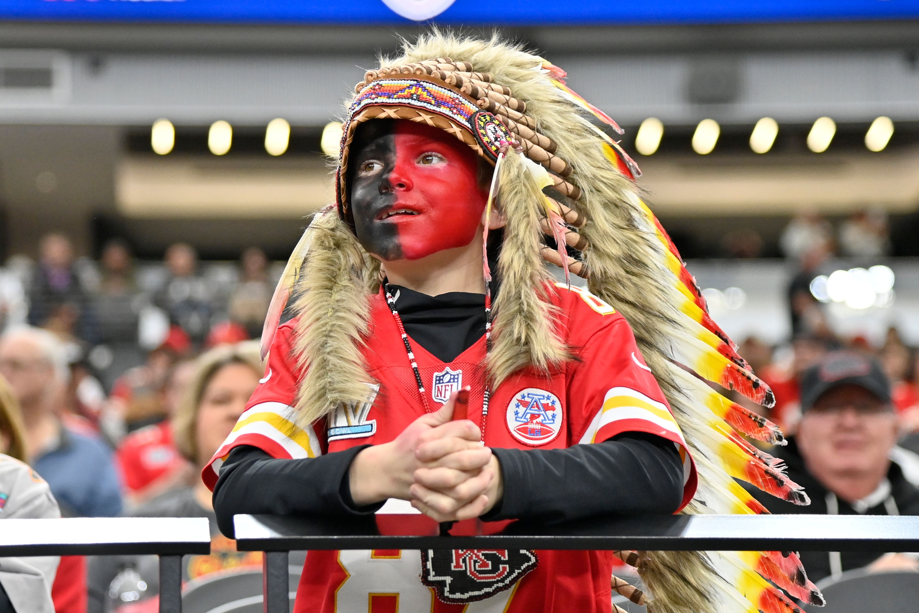 FILE - A young Kansas City Chiefs fan, dressed with a headdress and face paint, looks on during an NFL football game against the Las Vegas Raiders, Sunday, Nov. 26, 2023, in Las Vegas. (AP Photo/David Becker, File)