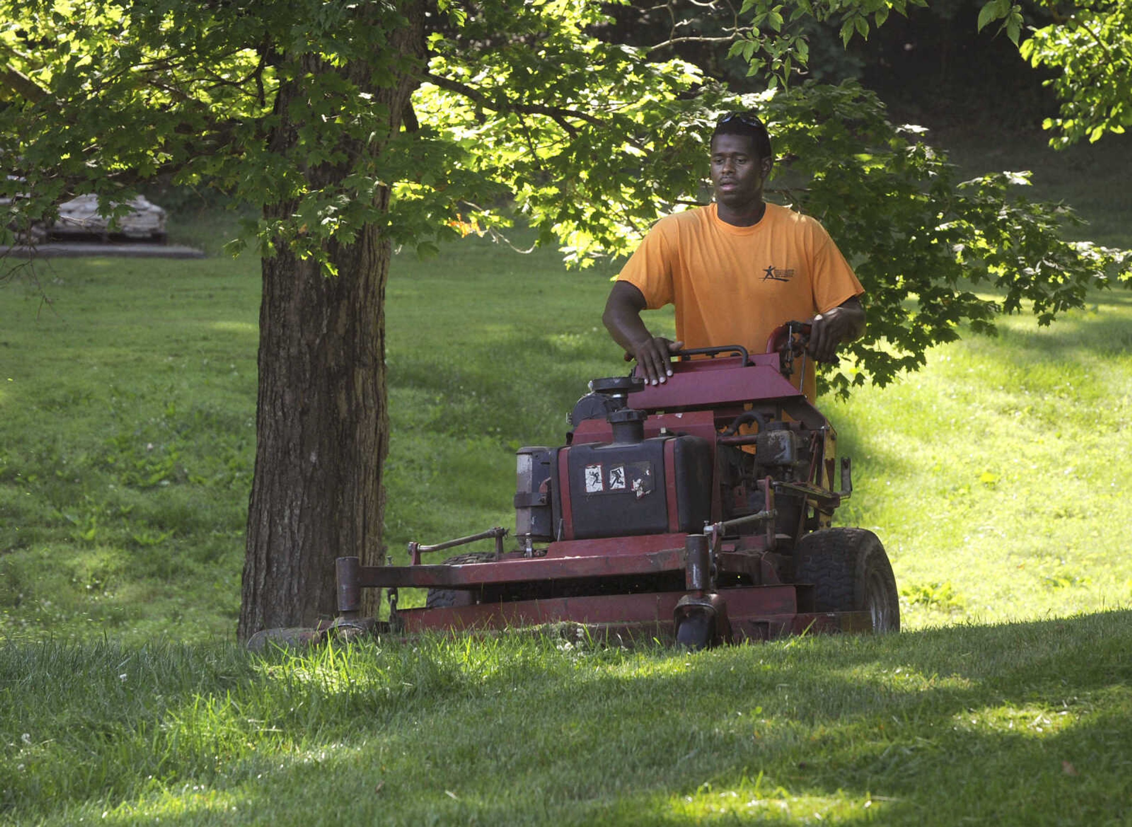 FRED LYNCH ~ flynch@semissourian.com
Latrail Glasper, a student at Adult and Teen Challenge Mid-America, mows a lawn Saturday, June 3, 2017 in Cape Girardeau.