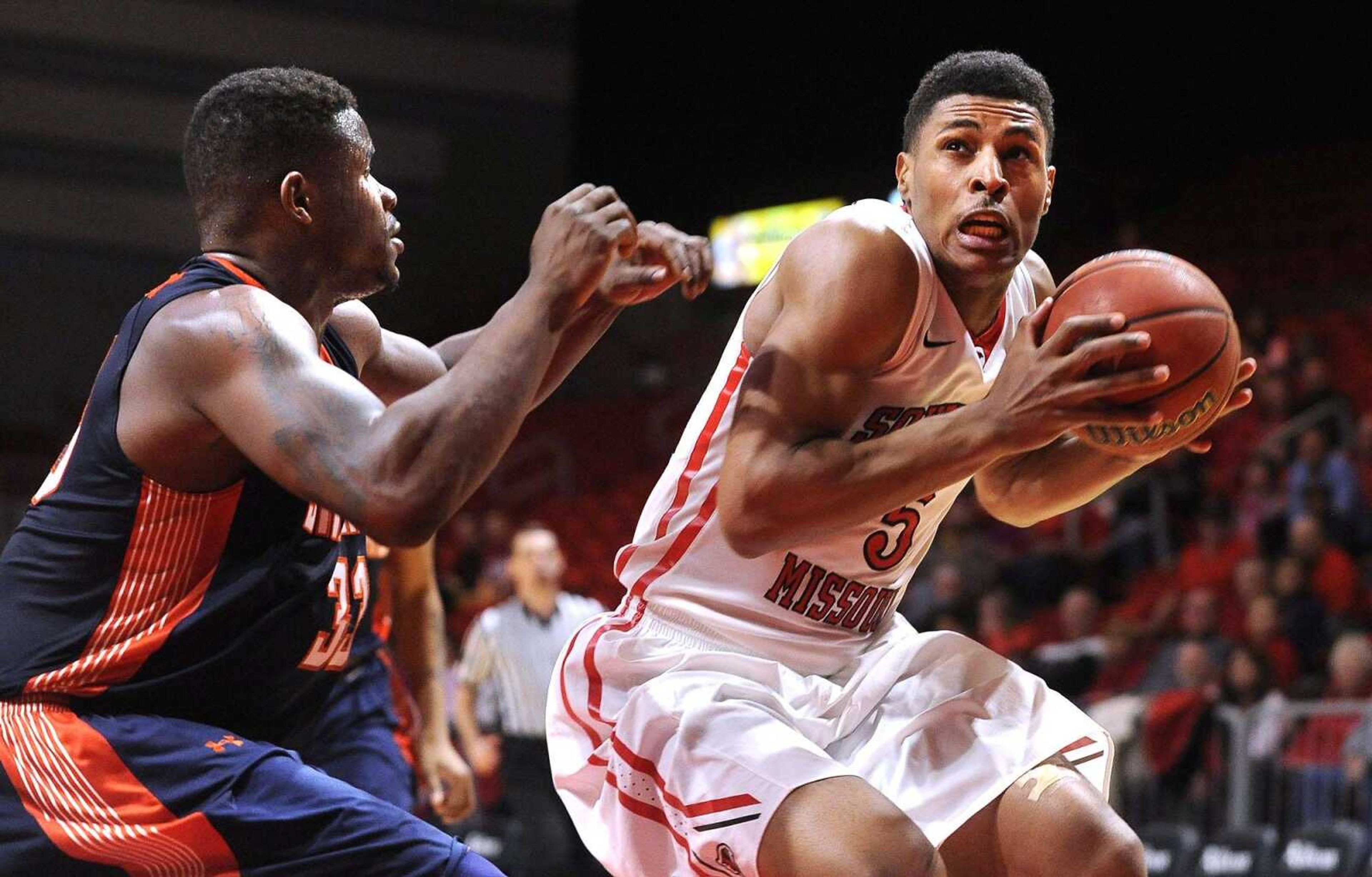 Southeast Missouri State's Joel Angus III drives to the basket as UT Martin's Myles Taylor defends during Sunday's game at the Show Me Center.