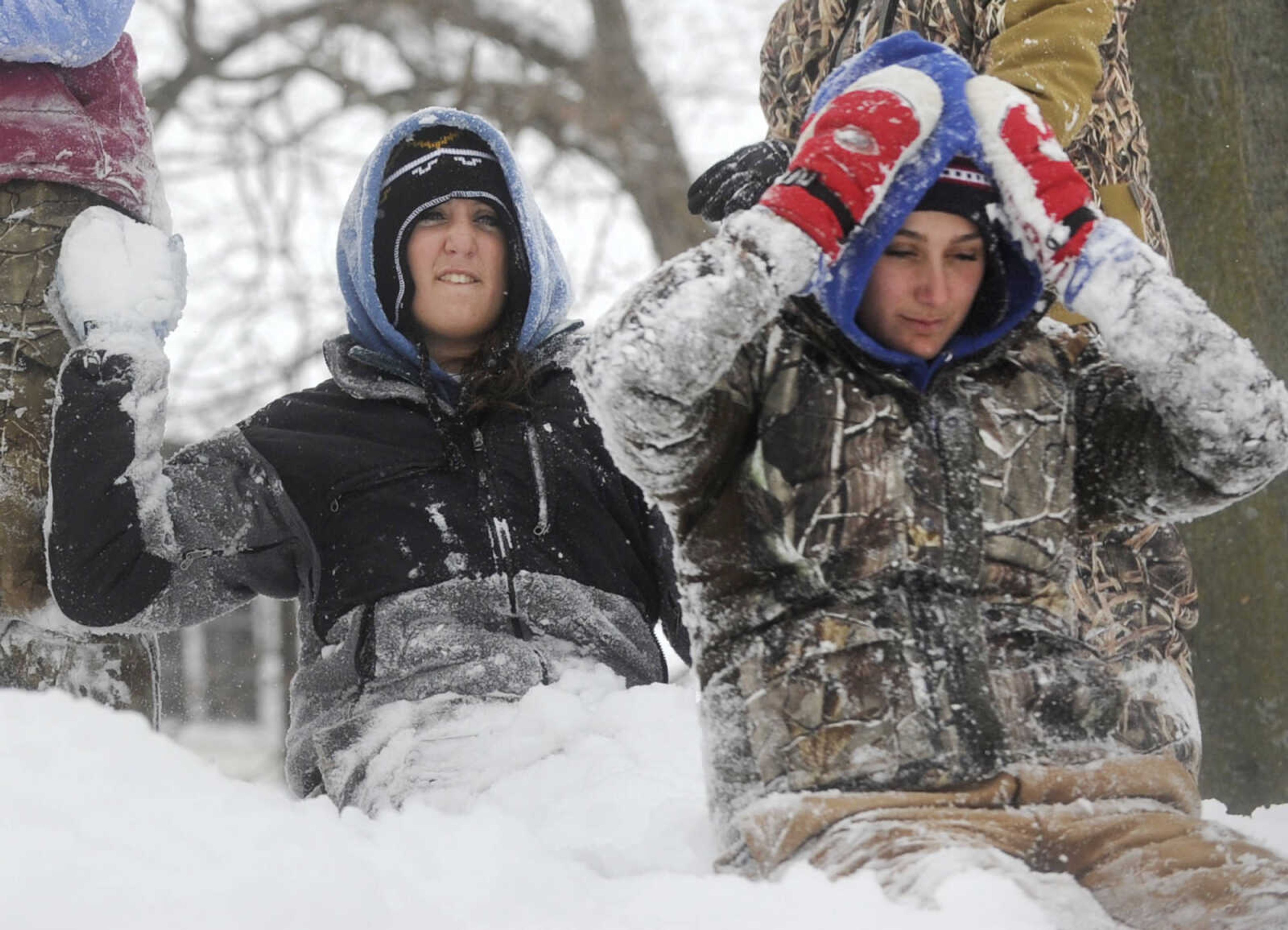 LAURA SIMON ~ lsimon@semissourian.com

Amber Bergman gets ready to hit her sister Abigail with a snowball, Monday, Feb. 16, 2015, in Cape Girardeau.