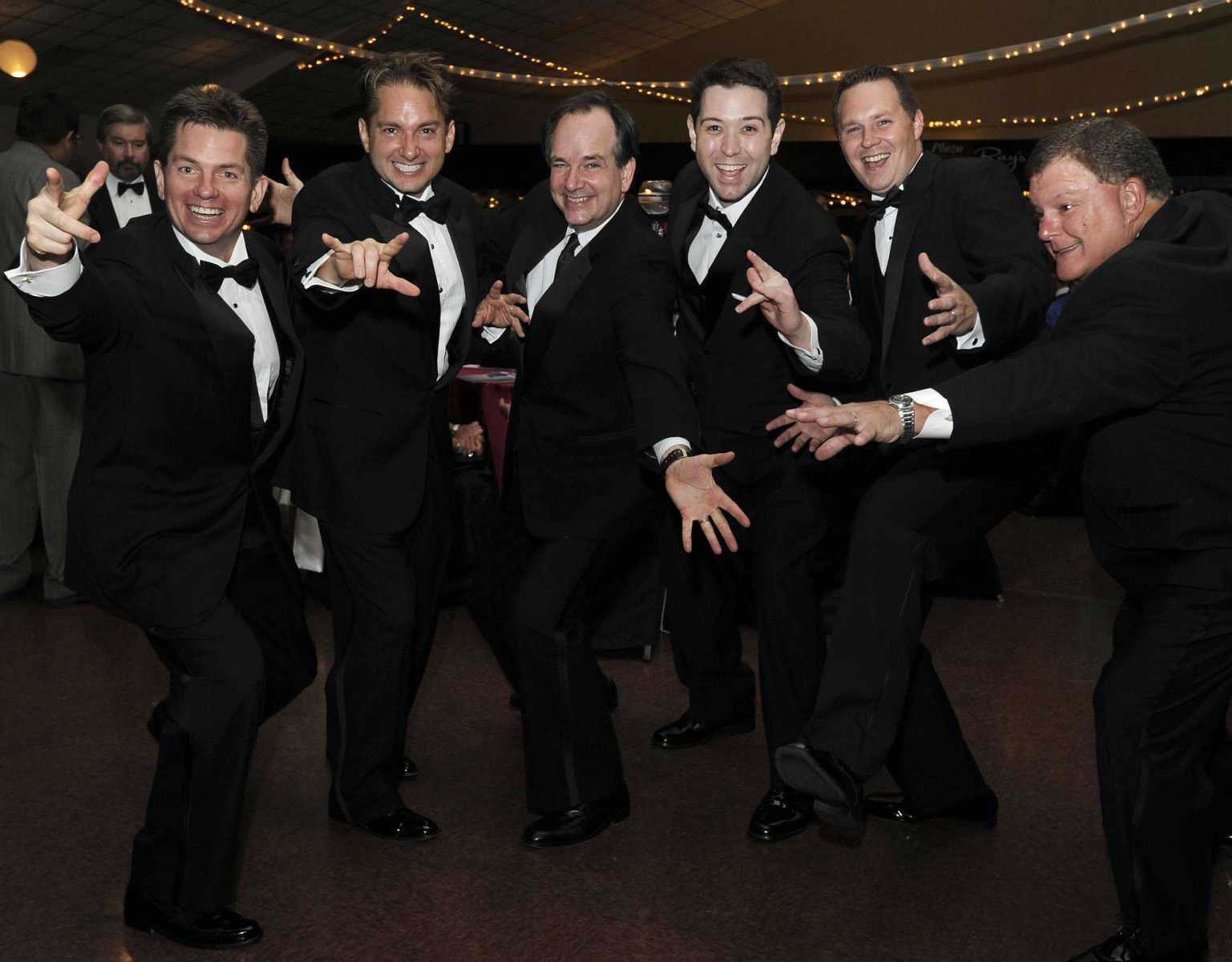 Attending the 26th annual A Cure for Cape Cancer Gala on Aug. 24, 2013, in Cape Girardeau are, from left,Rex Rust, Jon K. Rust, Gary Rust II, Lucas Presson, Shad Burner and Mark Kneer.