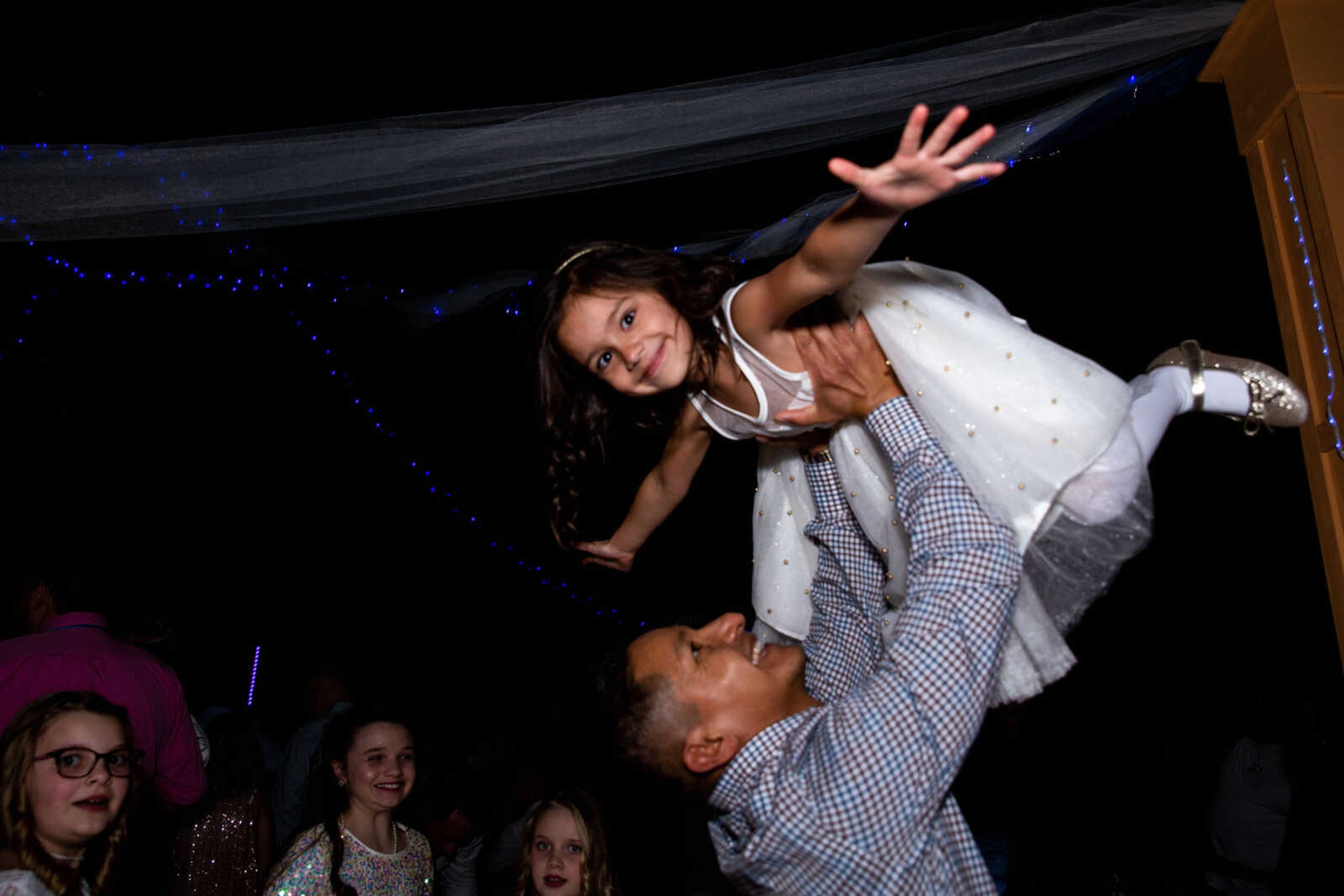 Ed Heath and daughter Millie Heath, 5, dance together.