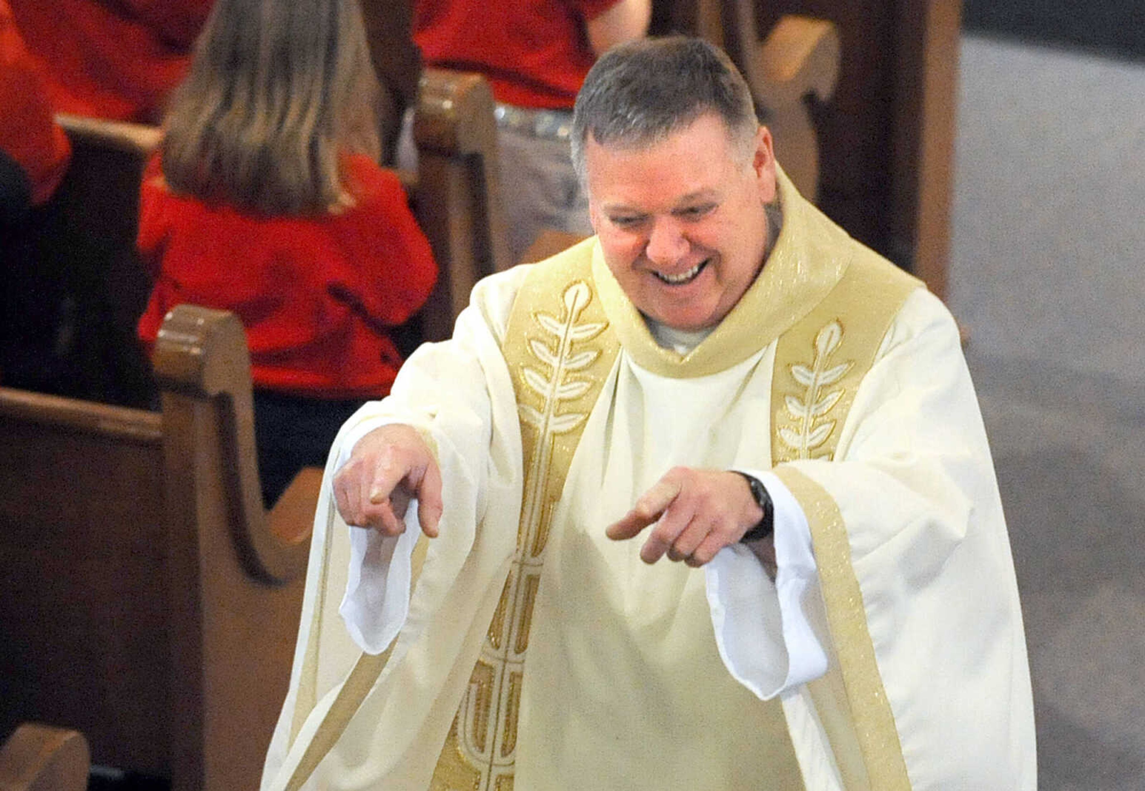 LAURA SIMON ~ lsimon@semissourian.com
Rev. Tom Kiefer gives a shout out to the adults and their participation in the singing of "Father, We Adore You" Friday morning, March 15, 2013 during the Mass of Thanksgiving at St. Mary's Cathedral in Cape Girardeau. The mass was in honor of the election of Pope Francis I.