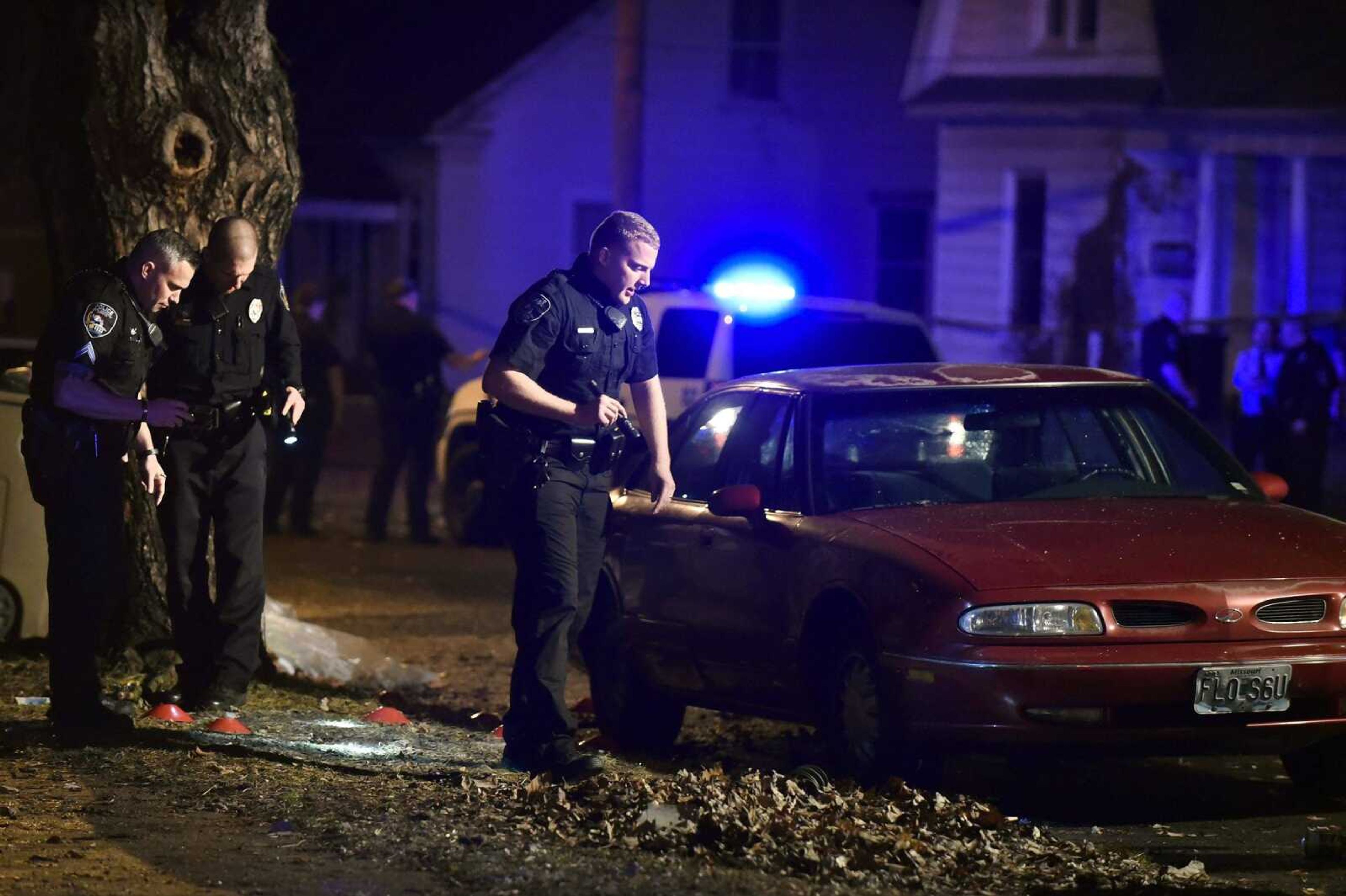 Officers with the Cape Girardeau Police Department search for evidence after a shooting on the 1000 block of Jefferson Avenue on Wednesday evening.