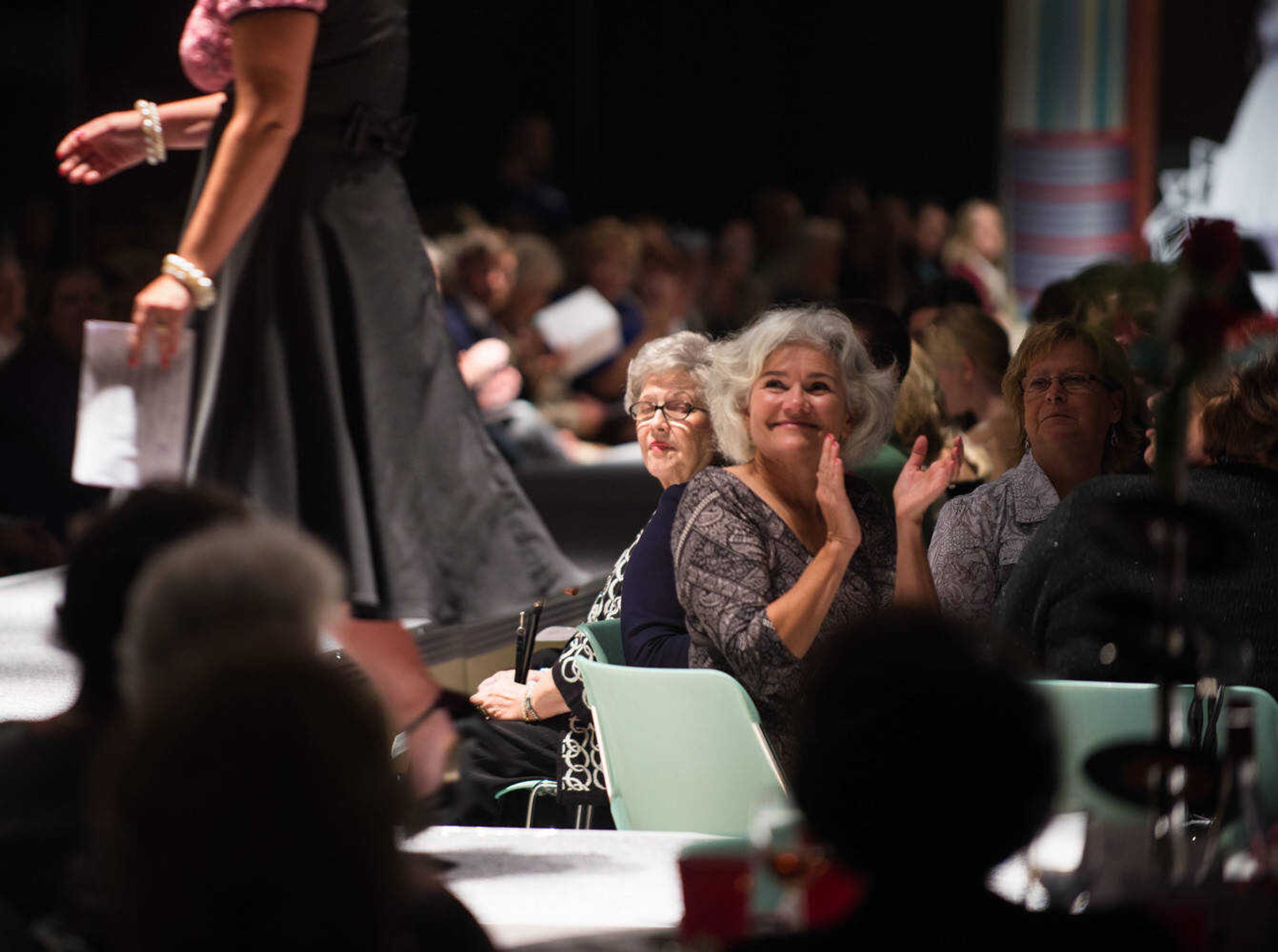 AARON EISENHAUER ~ photos@semissourian.com
Attendees applaud during the fifth annual VintageNOW fashion show, a fundraiser for Safe House for Women, at the Osage Centre on Friday, October 17, 2014.