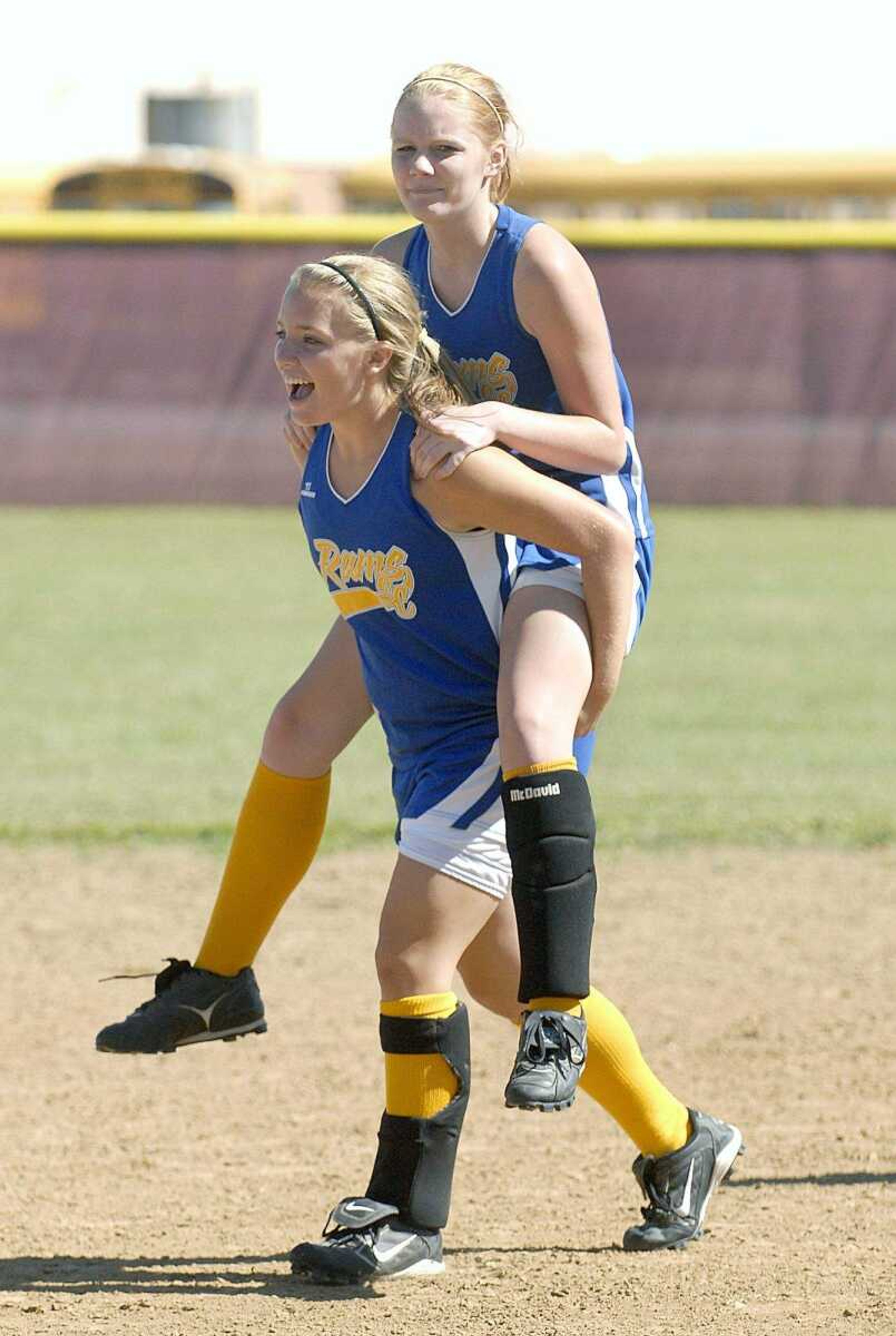 ELIZABETH DODD ~ edodd@semissourian.com
Scott City's Lindsey Hadley, left, gives teammate Courtney Bentley a lift after defeating St. Pius 2-0 in the District Tournament.