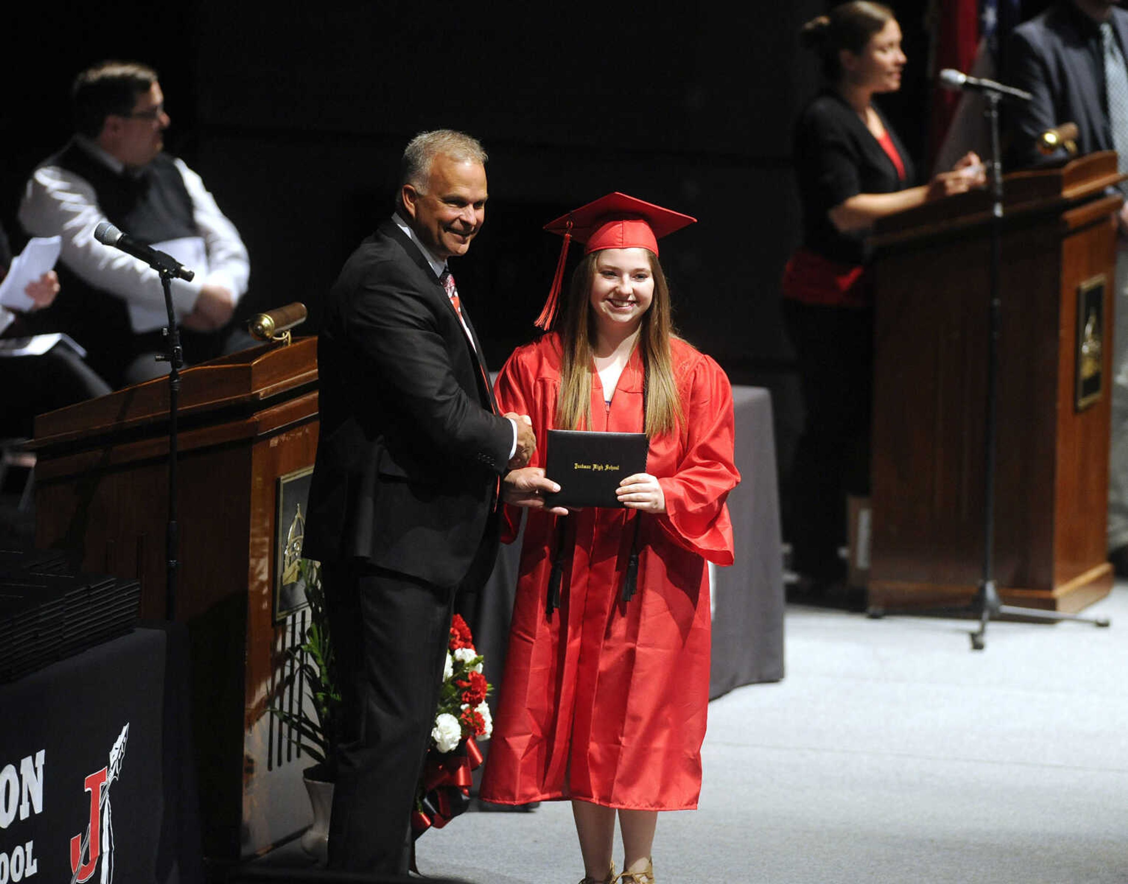 FRED LYNCH ~ flynch@semissourian.com
Jackson Board of Education president Kelly Waller present a diploma to Kelly Greenlee during the Jackson High School commencement Friday, May 18, 2018 at the Show Me Center.