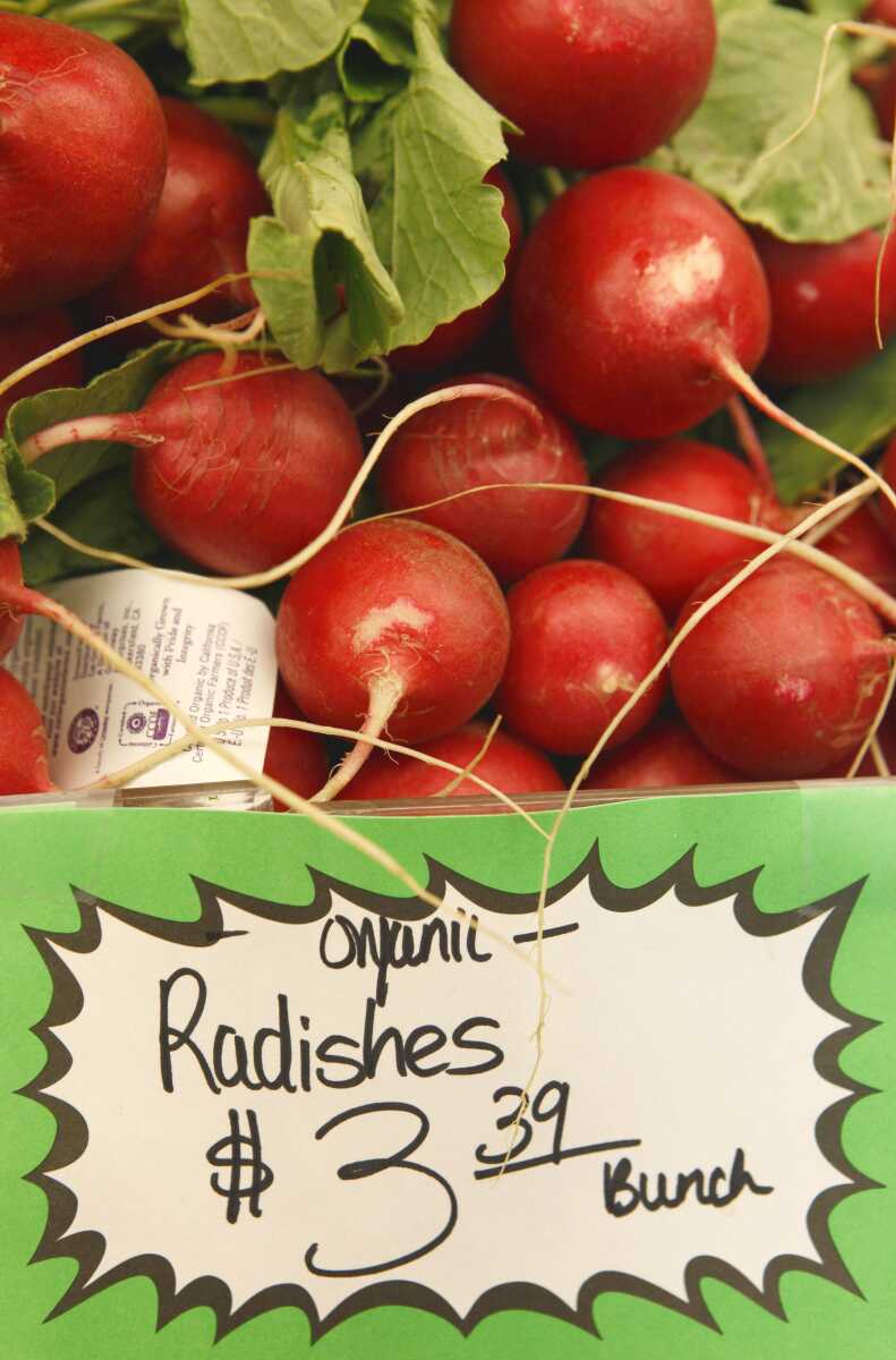 Organic radishes are on sale March 16, 2011, at a farmers market in Pacifica, Calif. (Associated Press file)