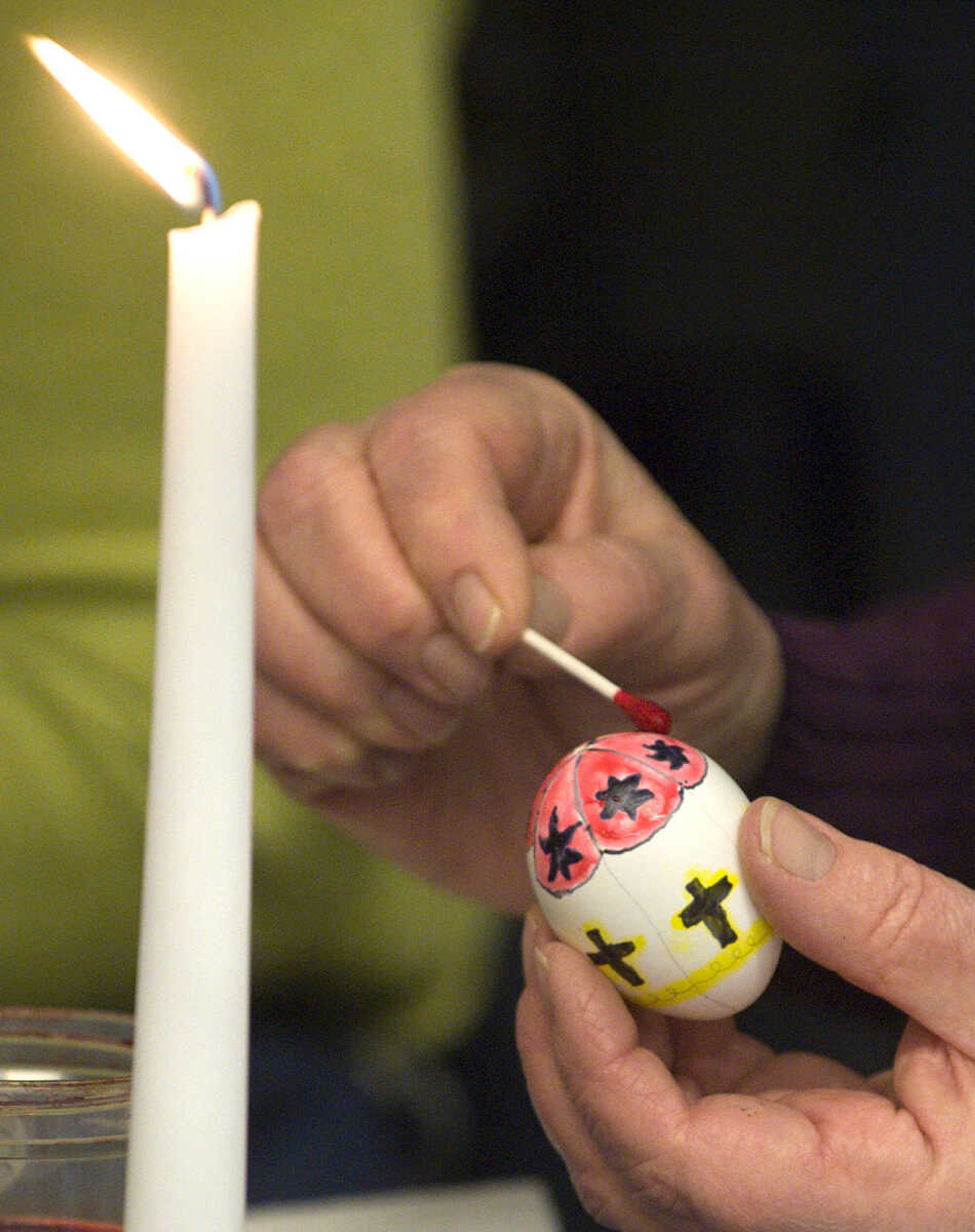 LAURA SIMON ~ lsimon@semissourian.com
A student applies dye to their egg Tuesday, March 19, 2013 during the Wonderful World of Pysanky workshop at Southeast Missouri State University's River Campus.