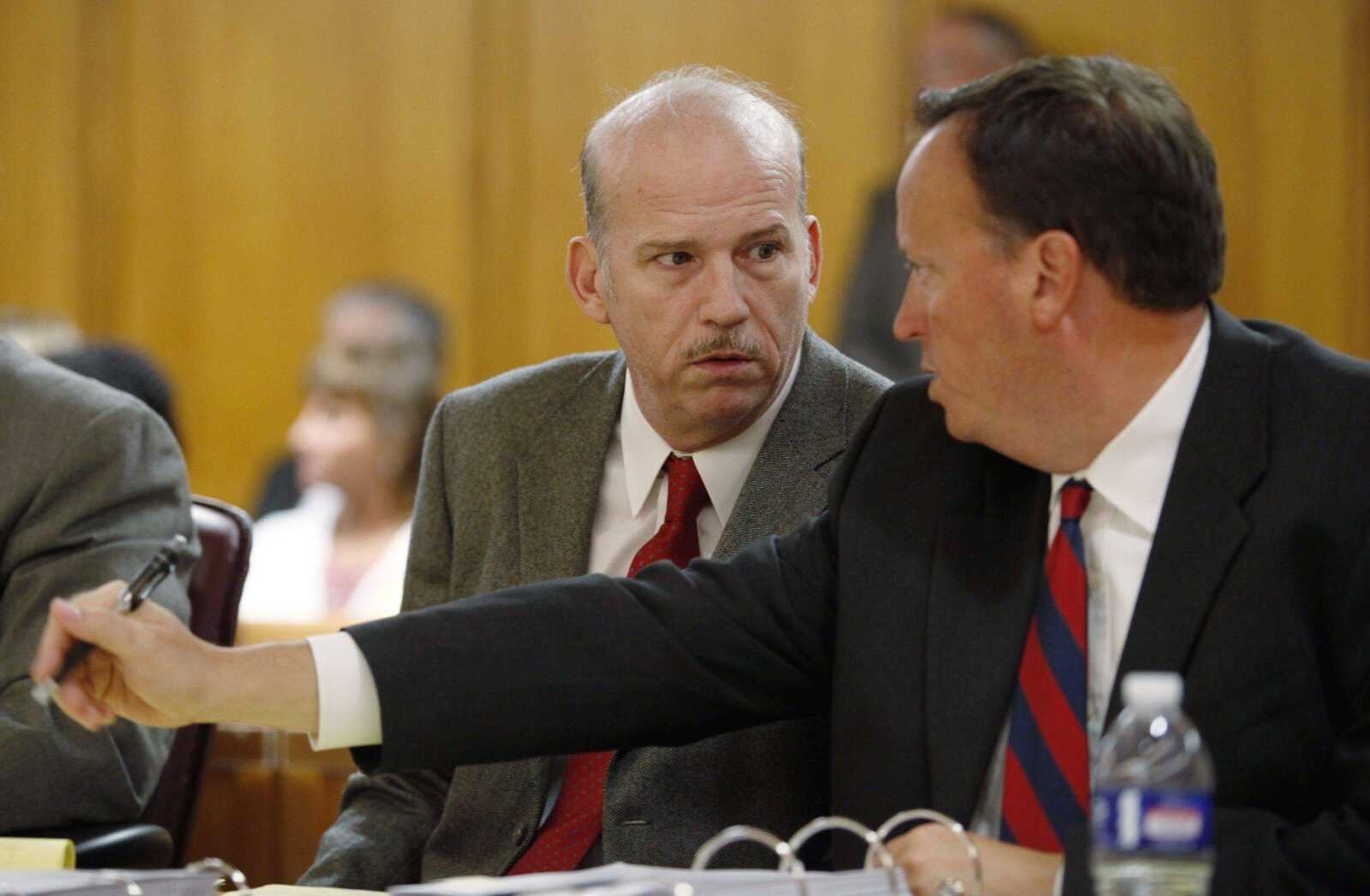 Scott Roeder, left, speaks with his attorney Mark Rudy during Roeder's preliminary hearing in court in Wichita, Kan. Tuesday, July, 28, 2009. Roeder, 51, is charged in the death of Dr. George Tiller. (AP Photo/Jaime Oppenheimer, Pool)