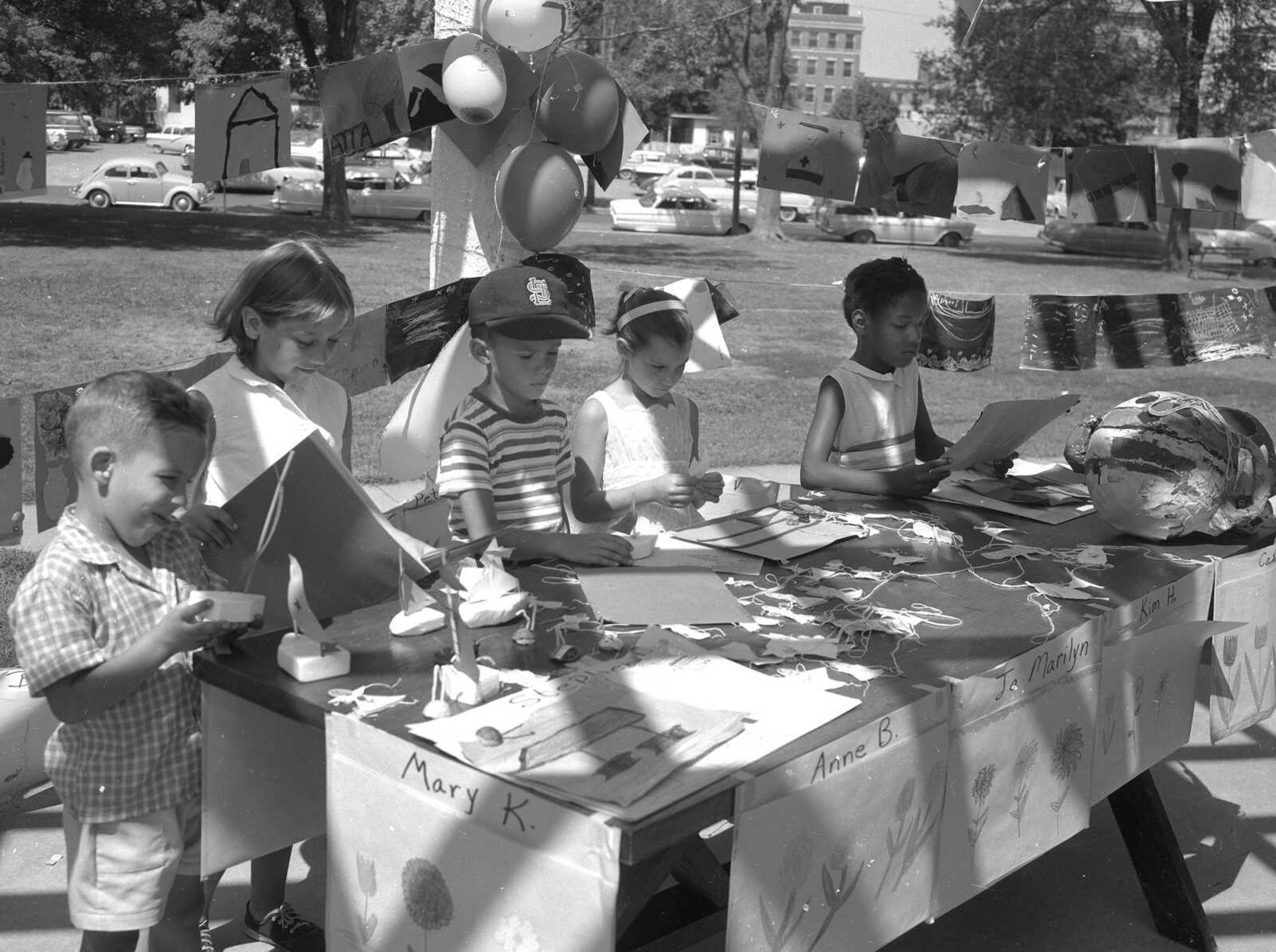 Youngsters work on art projects in Courthouse Park.