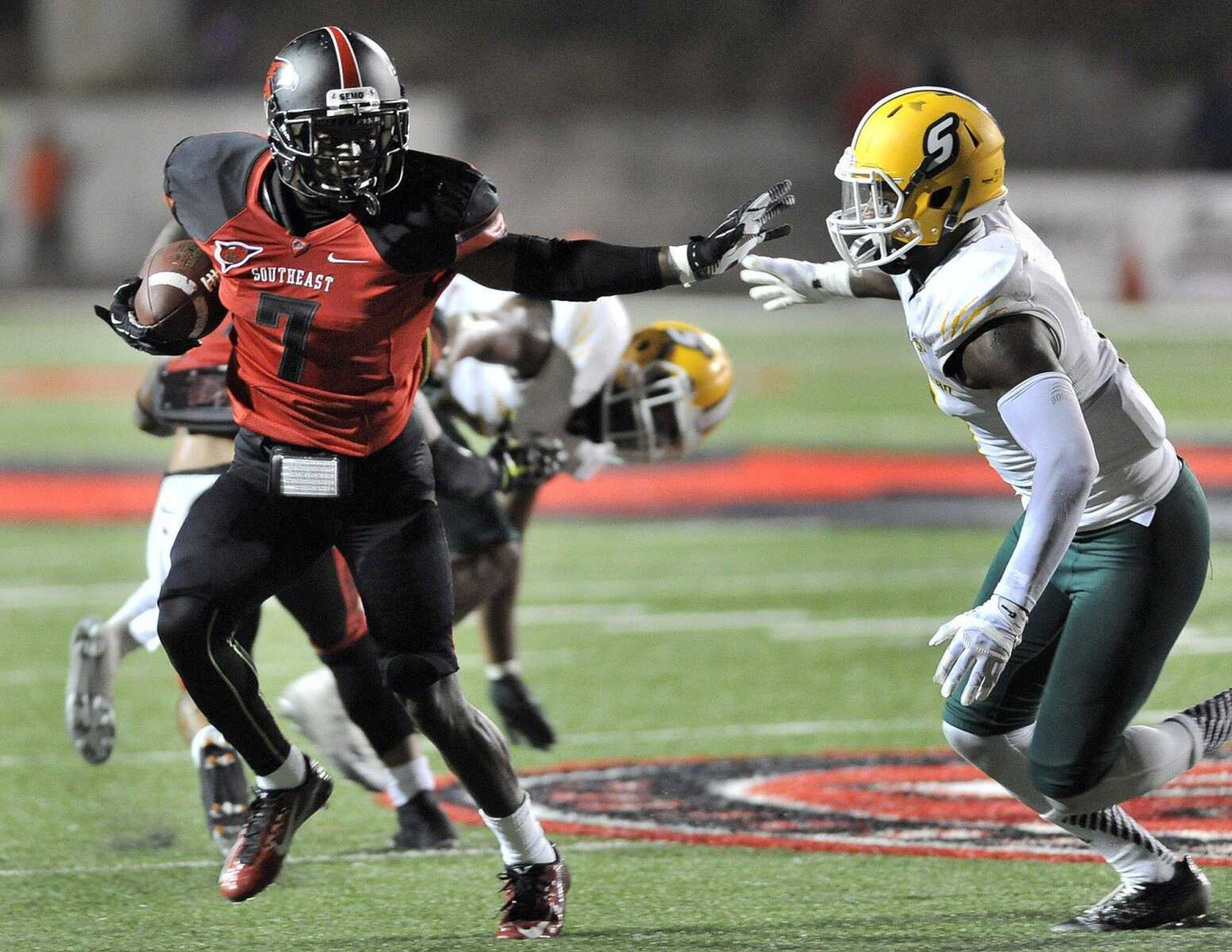 Southeast Missouri State wide receiver Peter Lloyd stiff-arms Southeastern Louisiana's Xavier Roberson during the fourth quarter Saturday, Sept. 20, 2014 at Houck Stadium. (Fred Lynch)