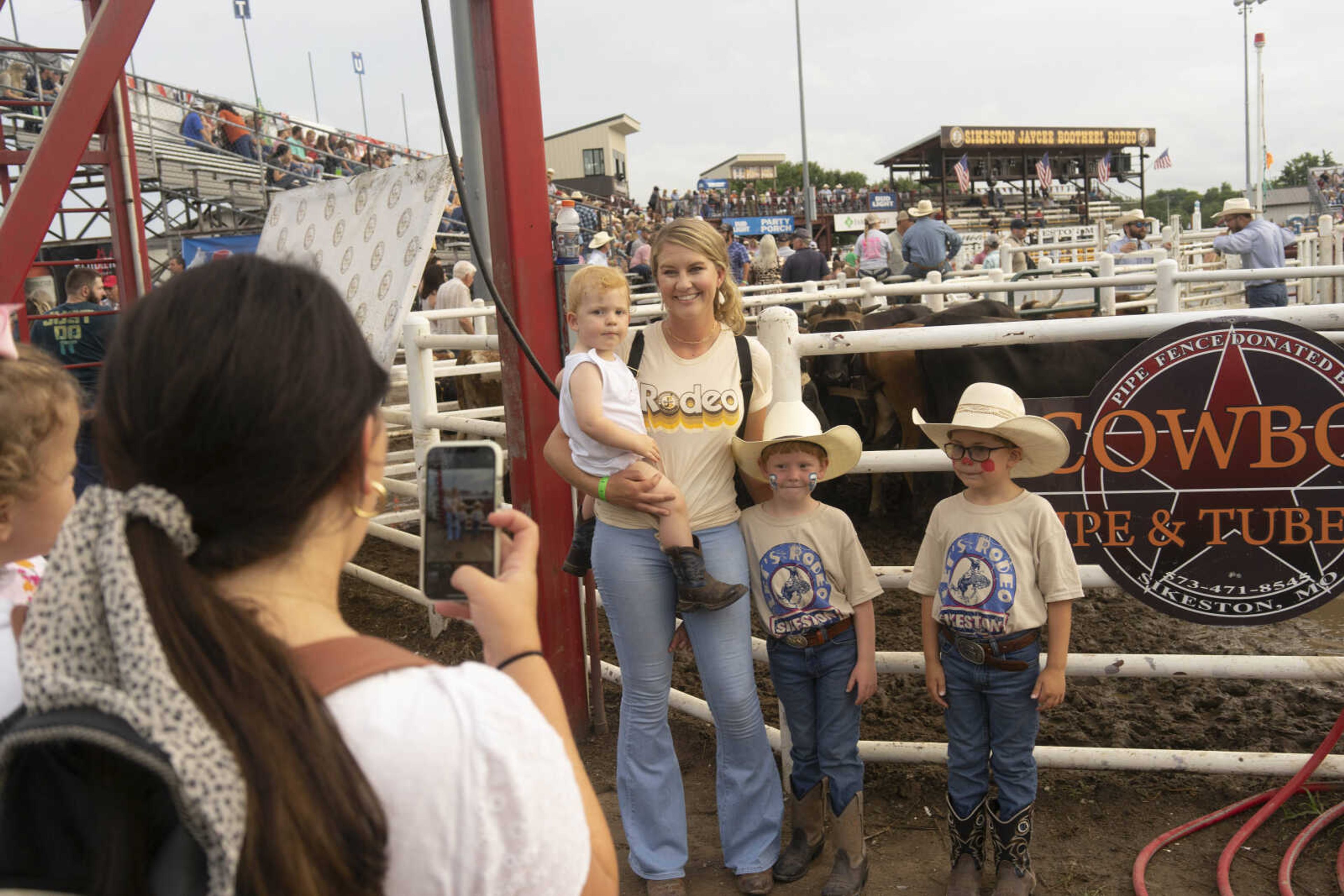 &nbsp;A family takes a photo before the third night of the Sikeston Jaycee Bootheel Rodeo Friday, Aug. 13, 2021,&nbsp;&nbsp;in Sikeston, Missouri.