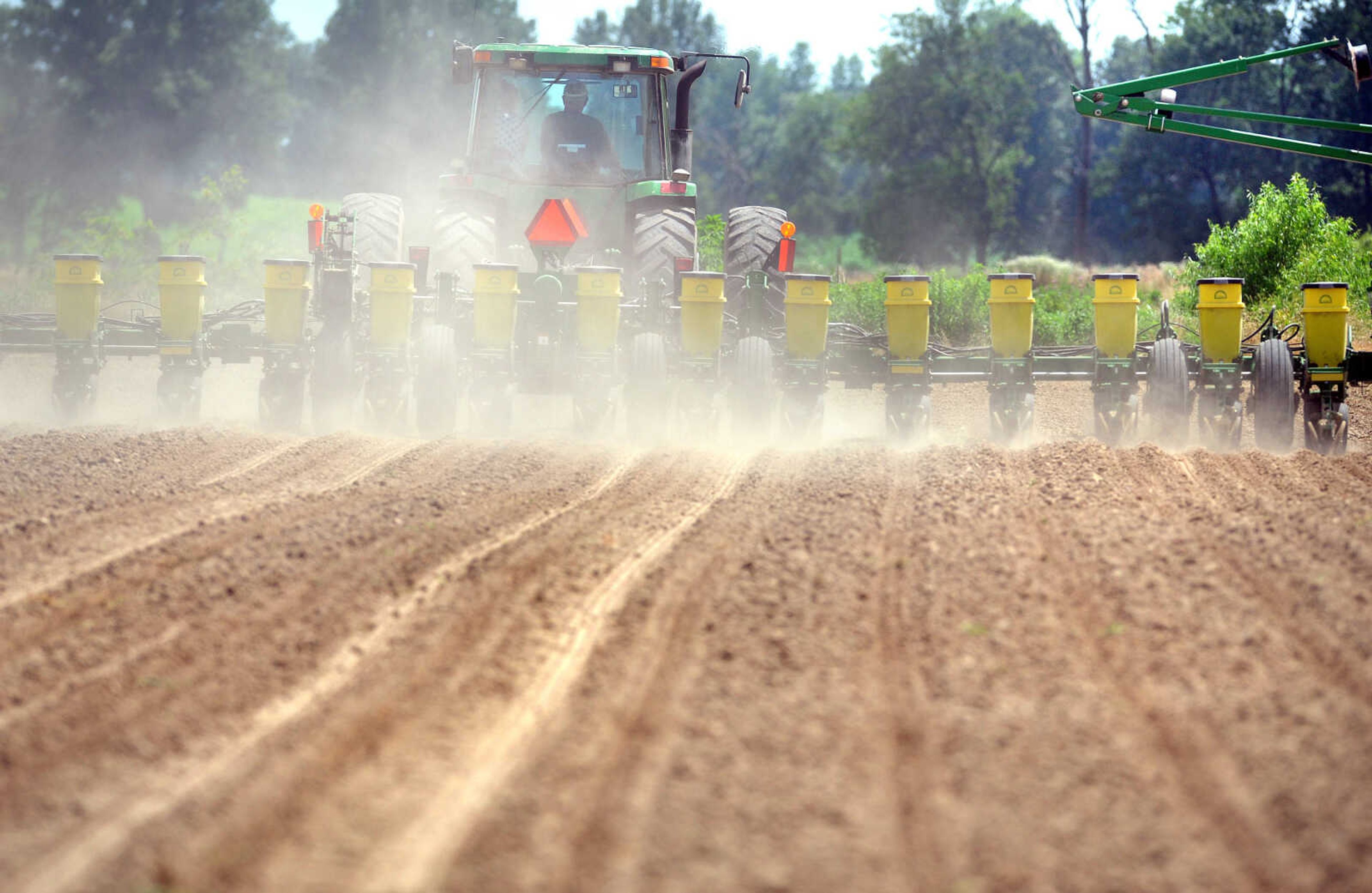 Frank Milde plants soybeans using his 16-row planter in his family's Cape Girardeau test field. (Laura Simon)