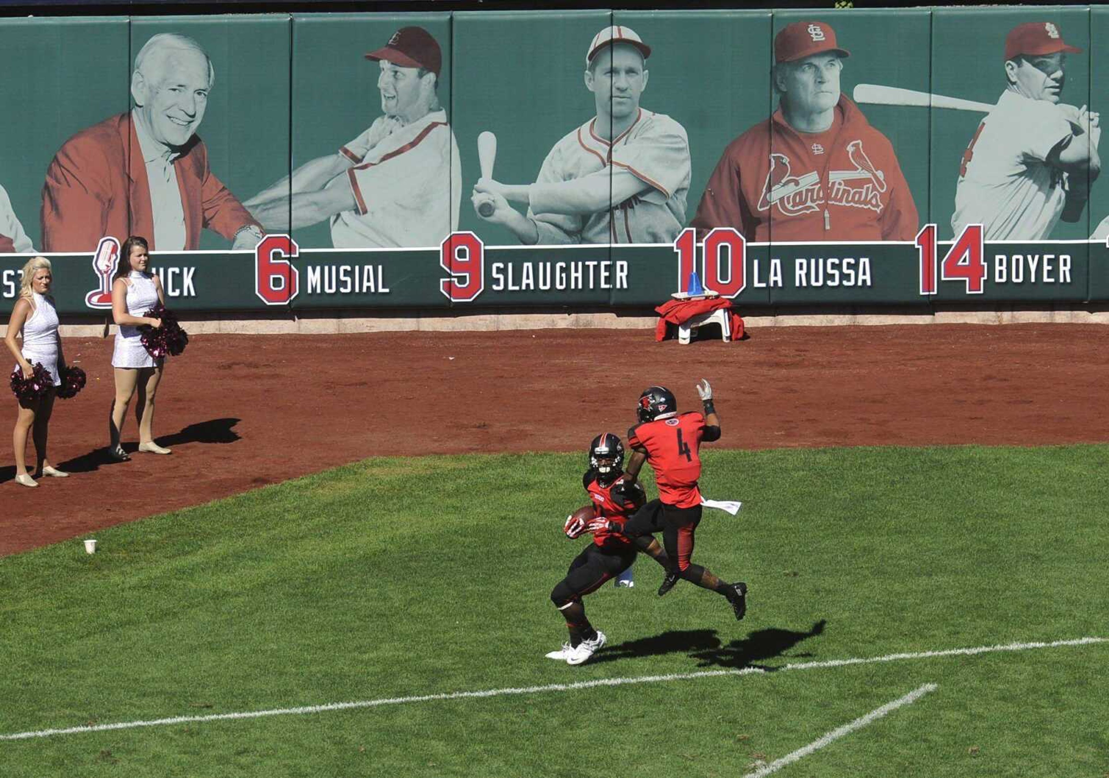 Southeast Missouri State wide receiver Paul McRoberts scores a touchdown against Southern Illinois to tie the score 19-19 as teammate Spencer Davis jumps in jubilation during the third quarter Saturday at Busch Stadium in St. Louis. (Fred Lynch)