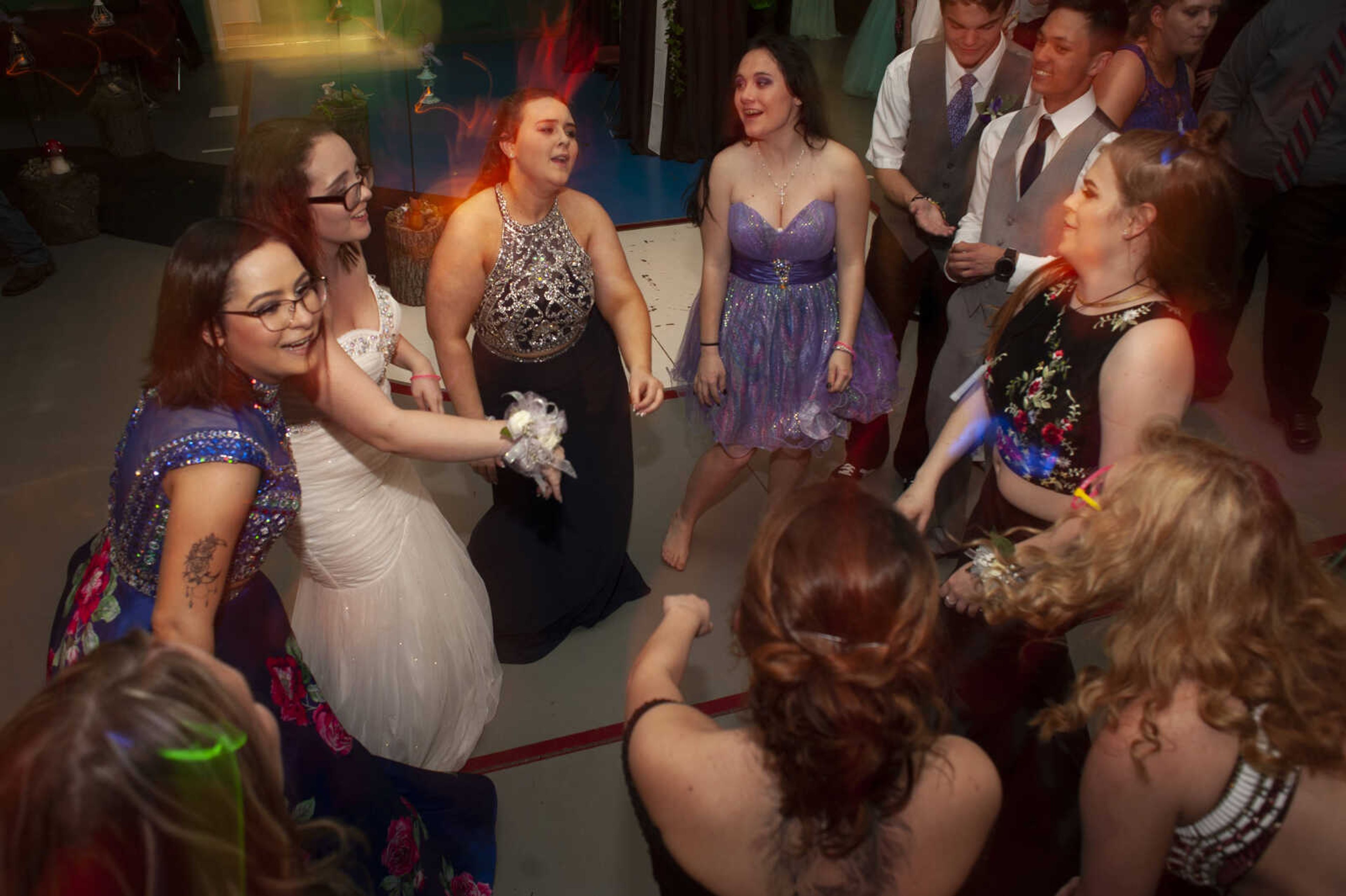 Prom guests dance during Delta High School's prom on Saturday, April 13, 2019, at the Delta Community Center.