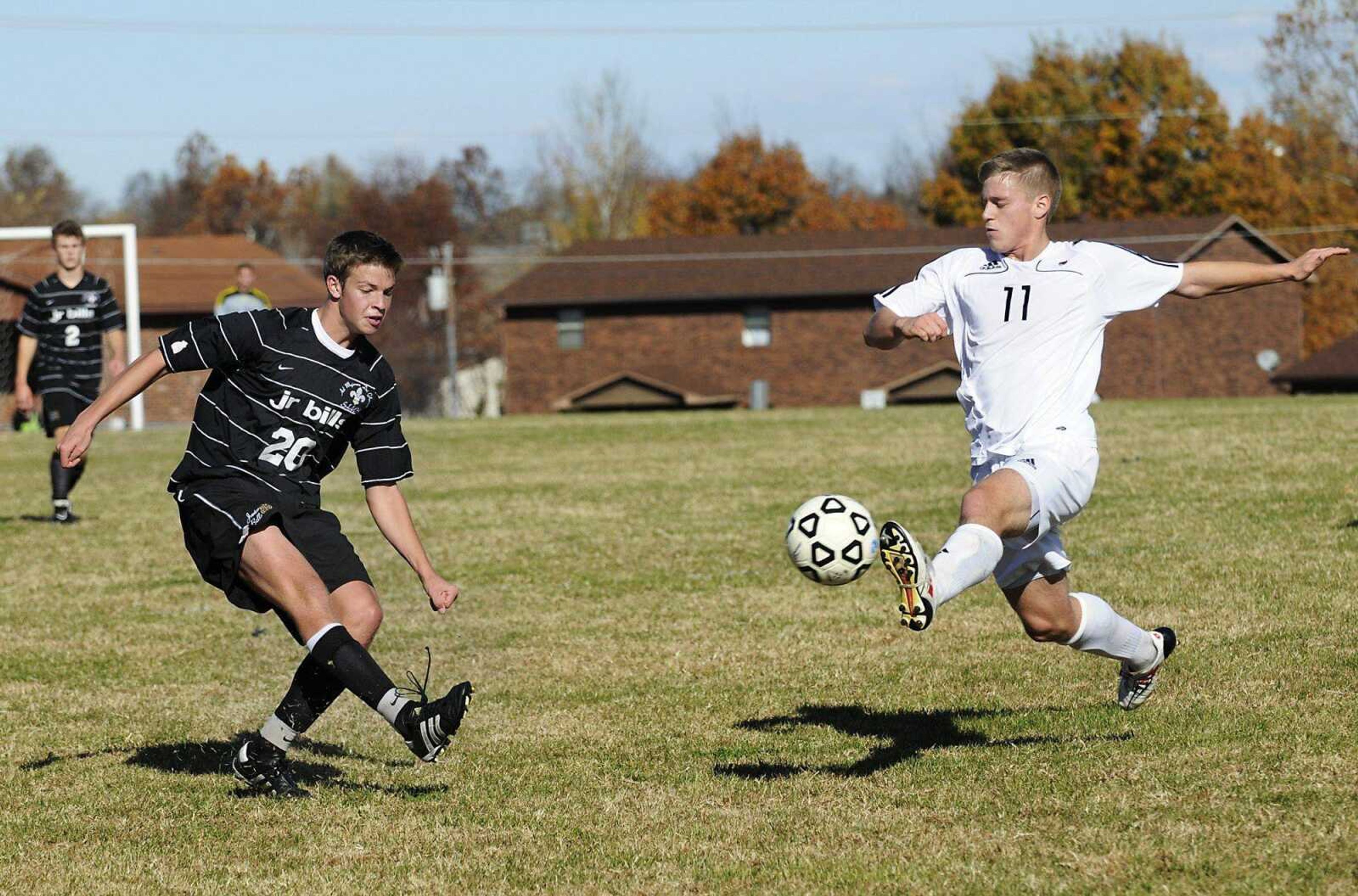 Jackson's Law Duncan lunges to stop a kick by Saint Louis University High's Tommy Behr during the first half of Saturday's Class 3 quarterfinal in Jackson. (Kristin Eberts)