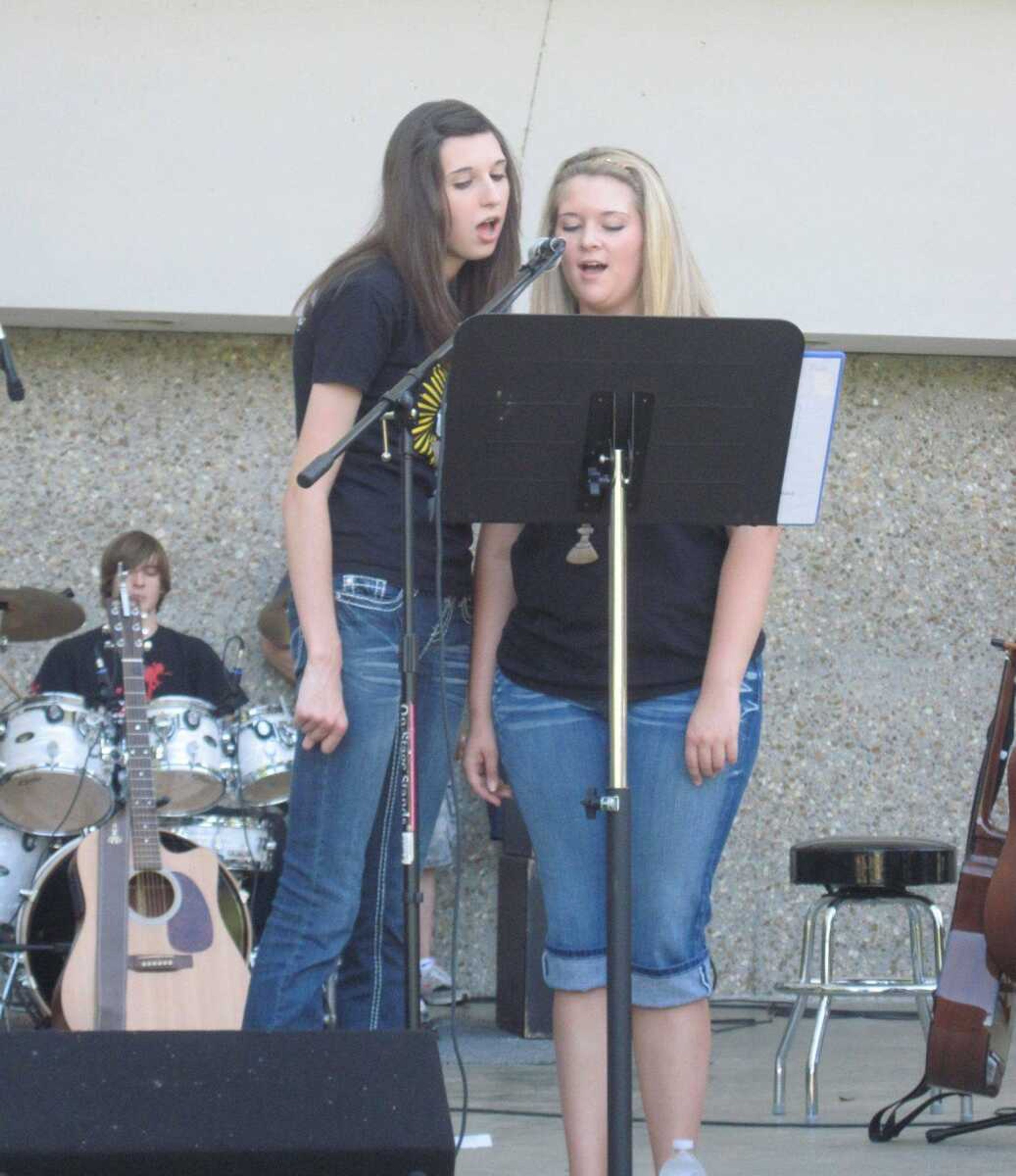 Allie Baugh and Chelsea Carroll with the Immaculate Conception Church praise team Youth Spirit perform "Forever" Saturday at Praise in the Park. (CARRIE BARTHOLOMEW)