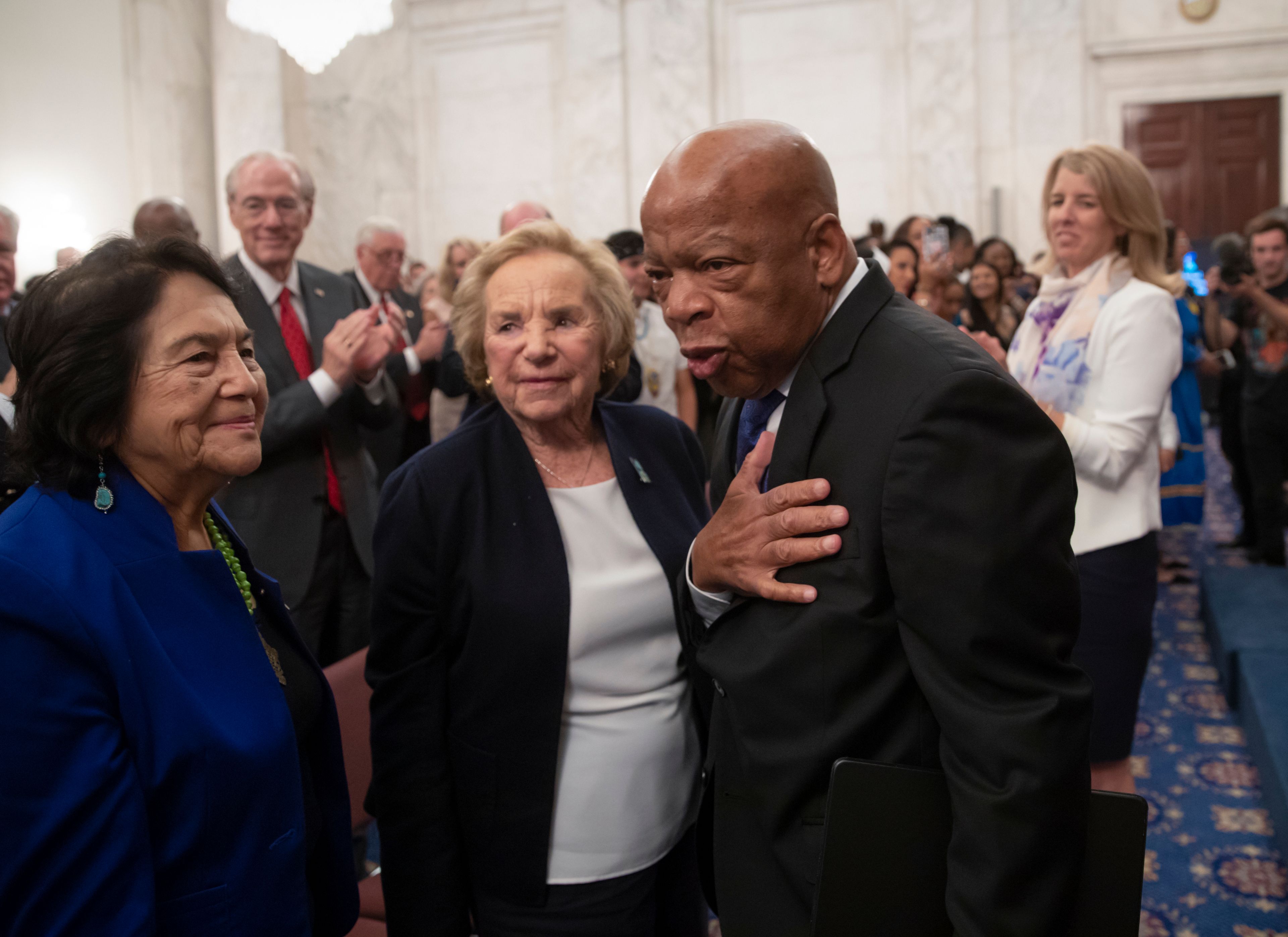 FILE - From left, Dolores Huerta, labor leader and civil rights activist, Ethel Kennedy, and civil rights leader Rep. John Lewis, D-Ga., are applauded during the Robert F. Kennedy Human Rights Award ceremony on Capitol Hill in Washington, Tuesday, June 5, 2018. (AP Photo/J. Scott Applewhite, File)