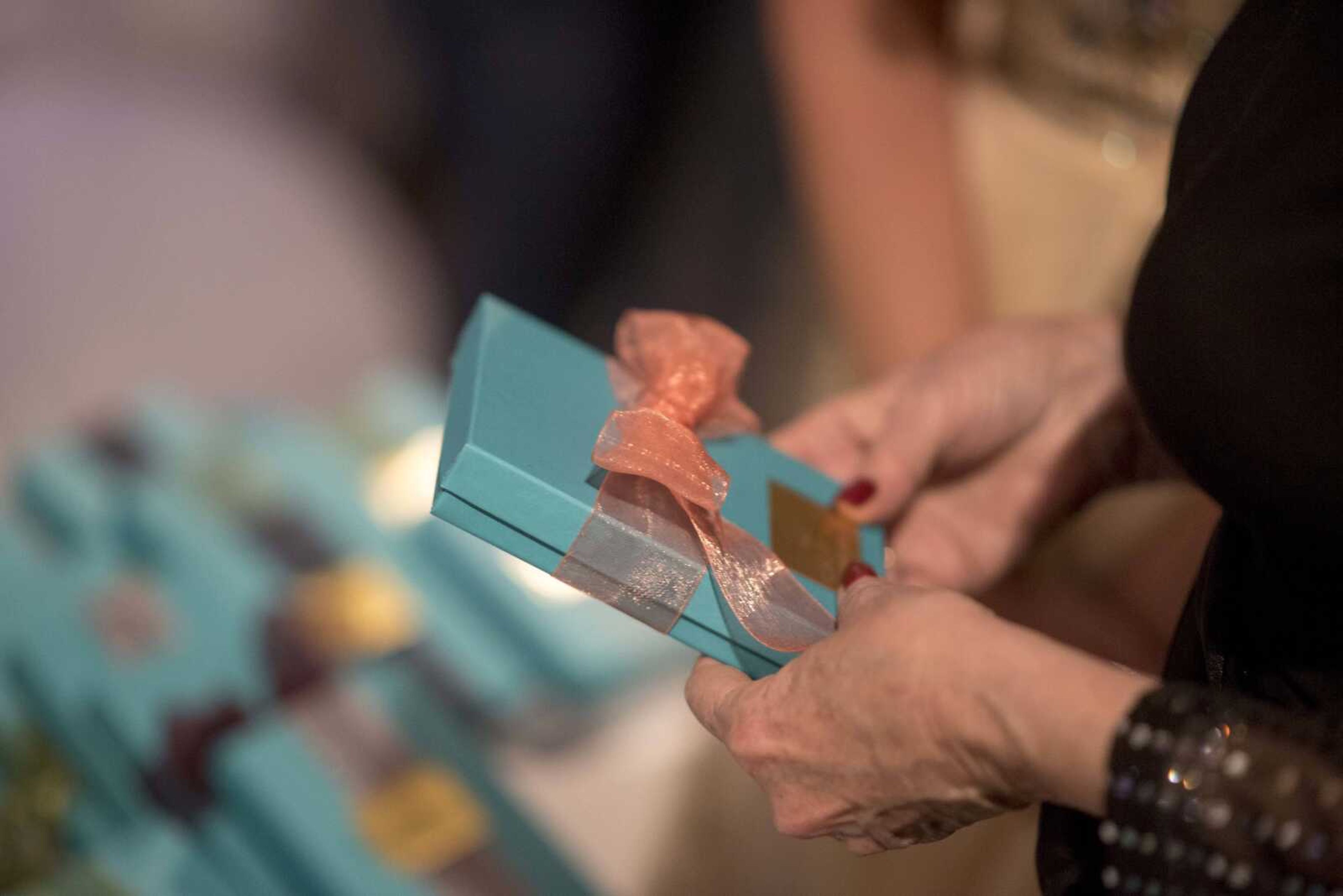 Mary Greenwood holds a jewelry box during a fundraising gala for the American Cancer Society at Rusted Route Farms Saturday, Nov. 16, 2019, in Cape Girardeau.