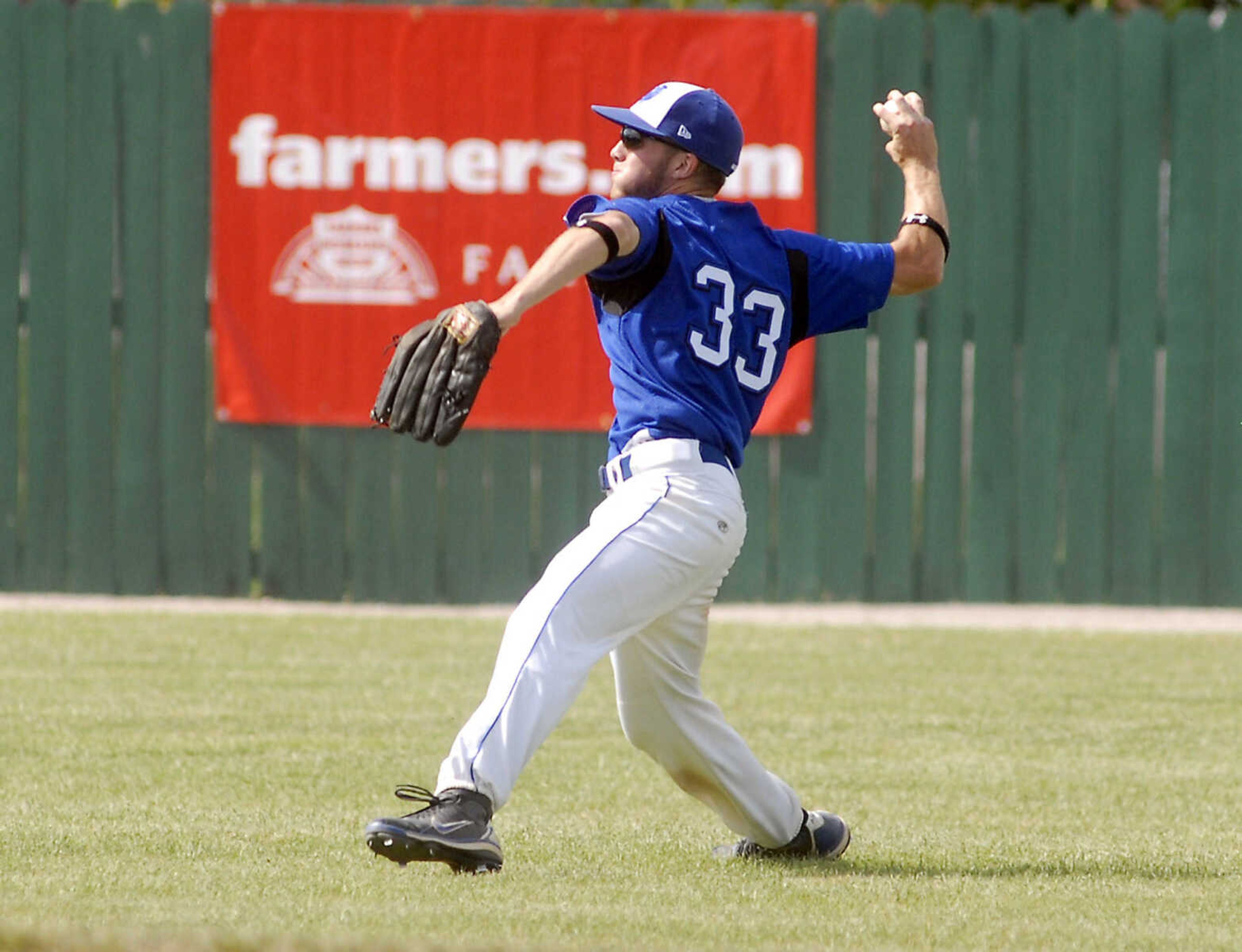 JUSTIN KELLEY photo
Notre Dame's Jake Pewitt throws the ball back to the infield during the Class 3 championship game Saturday, June, 6 2009, against Carl Junction at Meador Park in Springfield.