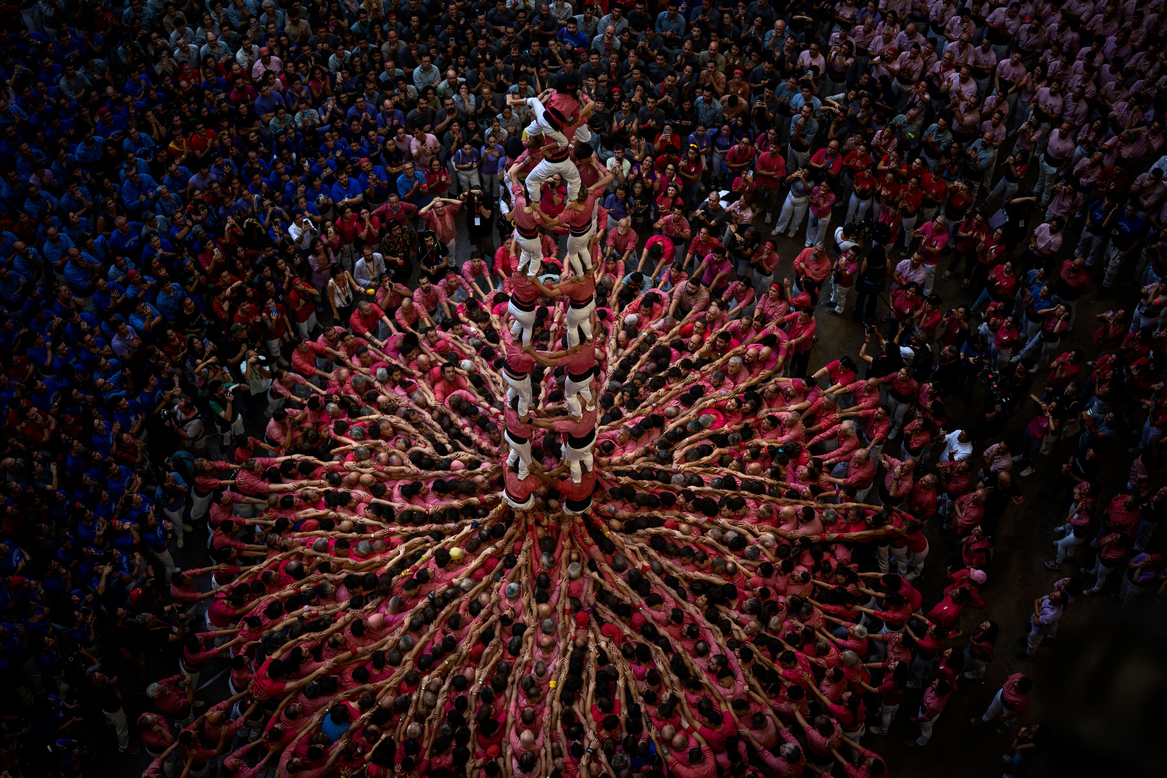 Members of "Vella de Valls" form a "Castell" or human tower, during the 29th Human Tower Competition in Tarragona, Spain, Sunday, Oct. 6, 2024. (AP Photo/Emilio Morenatti)