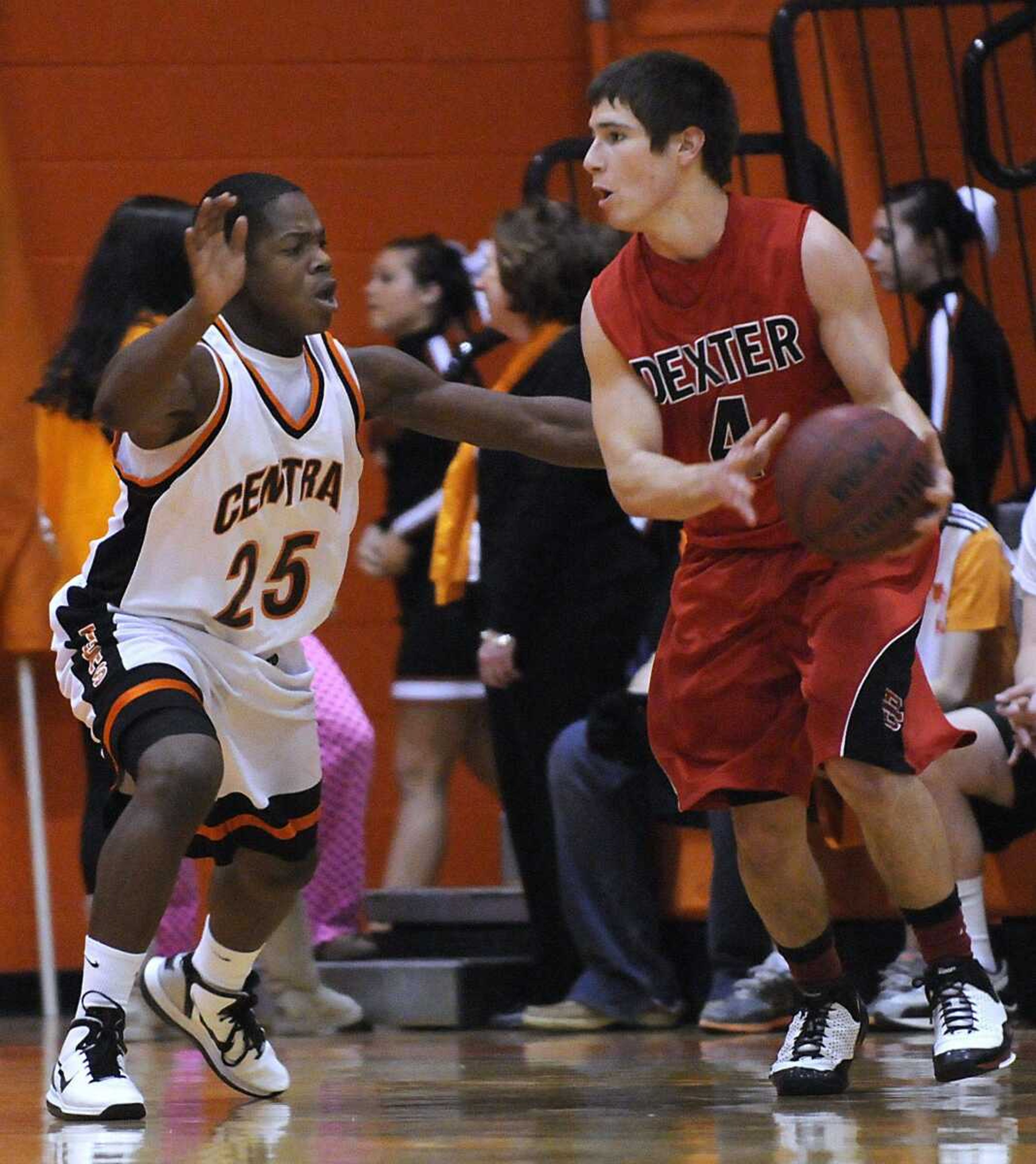 Central's Armondo Thatch defends Dexter's Jake Cox during the second quarter Friday. Central pulled away in the second half to post a 60-45 victory. (Kristin Eberts)