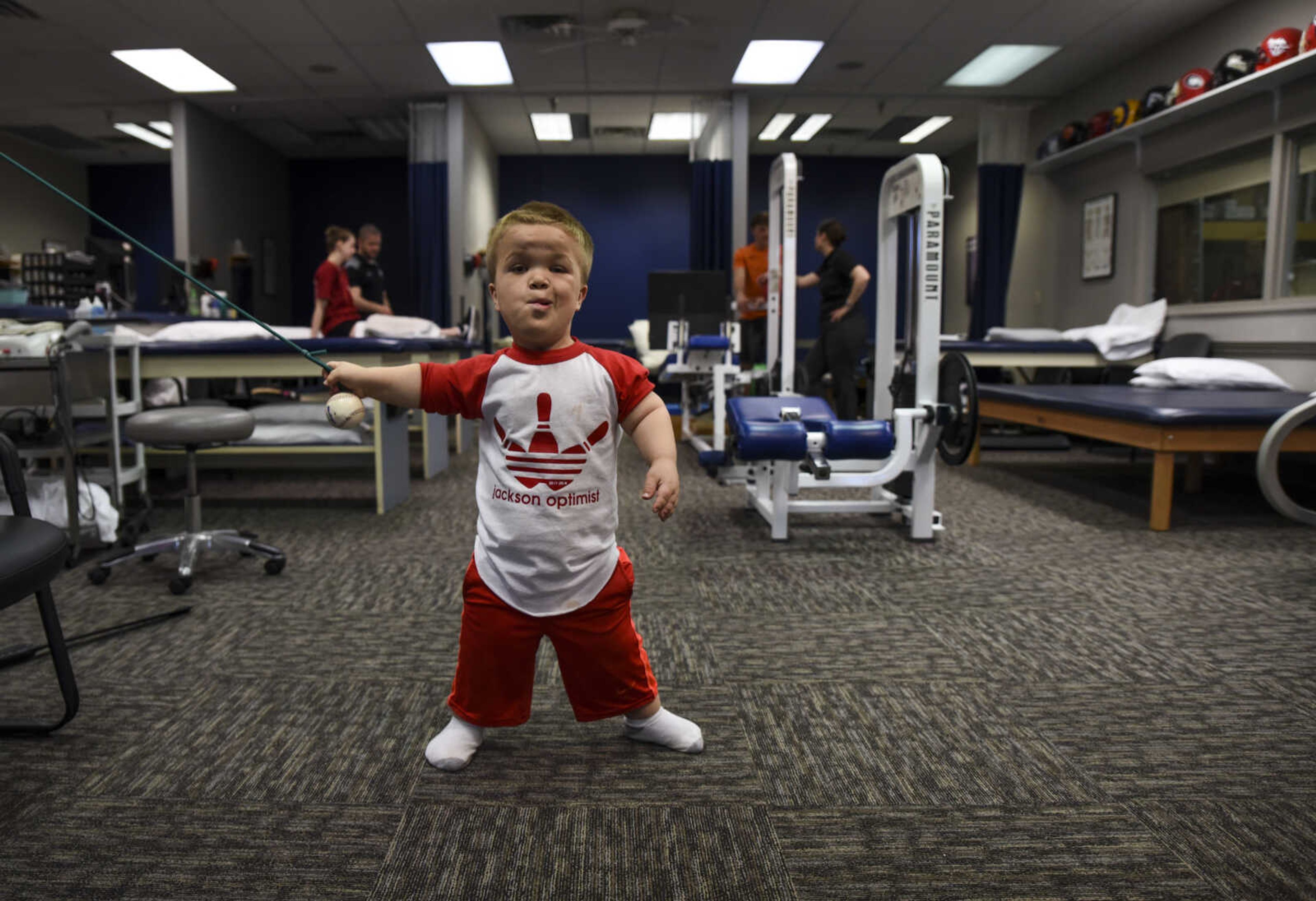 Izaac Pursley makes a face while he focuses on performing a physical therapy exercise during his first physical therapy session at Mid America Rehab May 1, 2018, in Cape Girardeau.