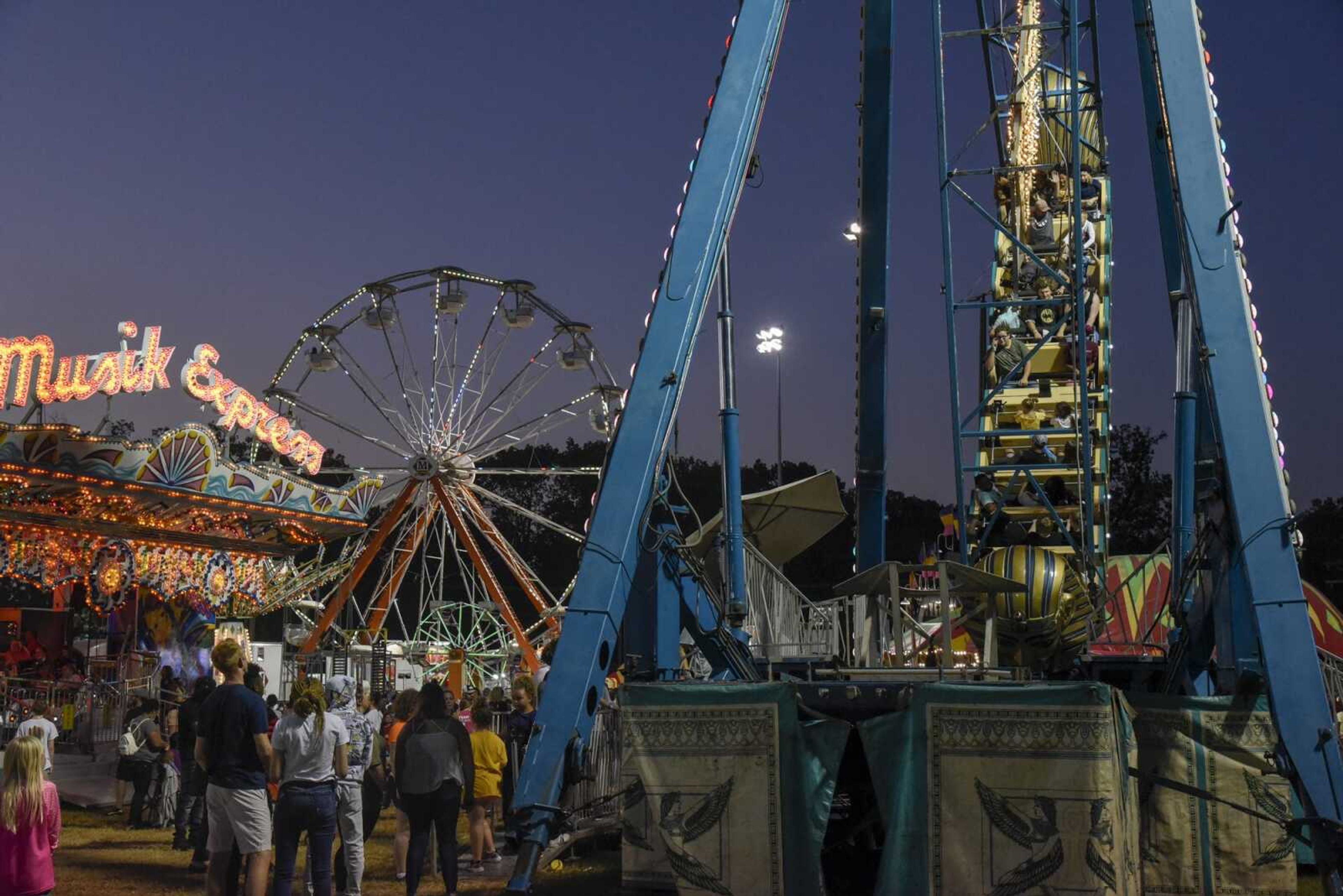 Attendees enjoy rides as it becomes dusk at the SEMO district fair Wednesday, Sept. 15, 2021 in Cape Girardeau.