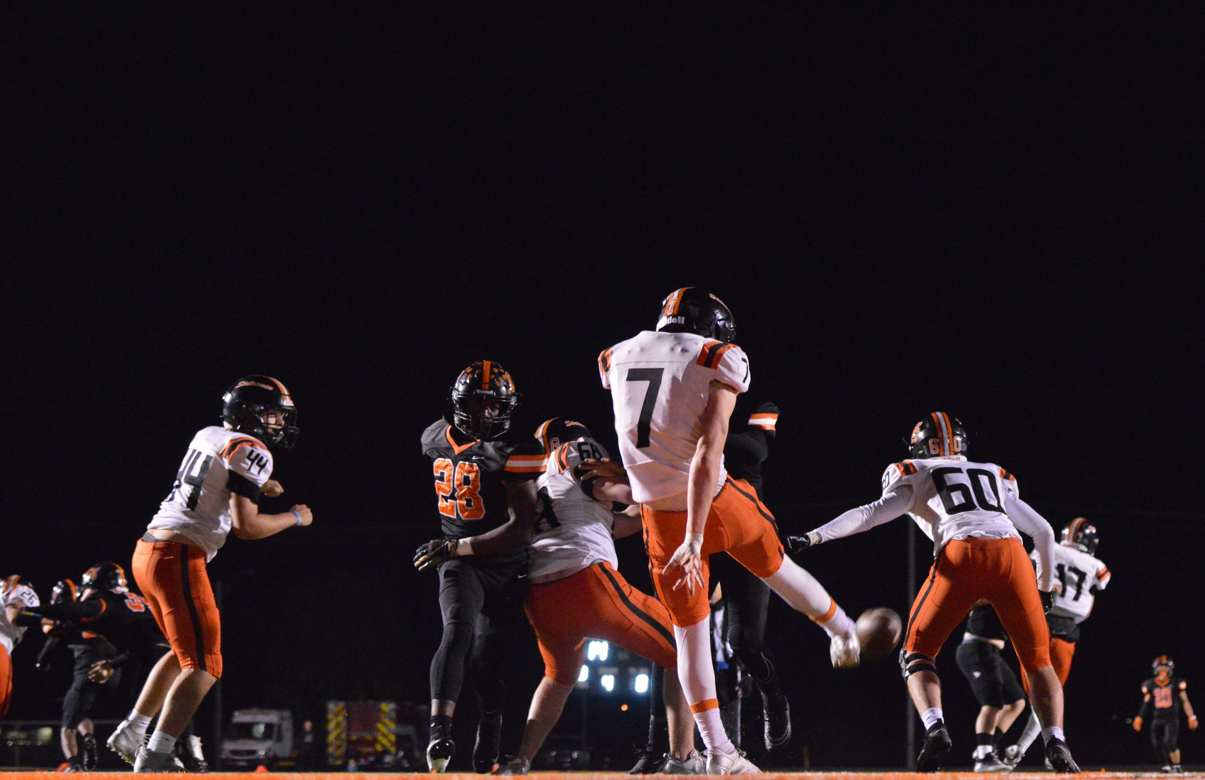 Webster Groves punts the ball away against Cape Central late in the first half on Friday, Nov. 1.