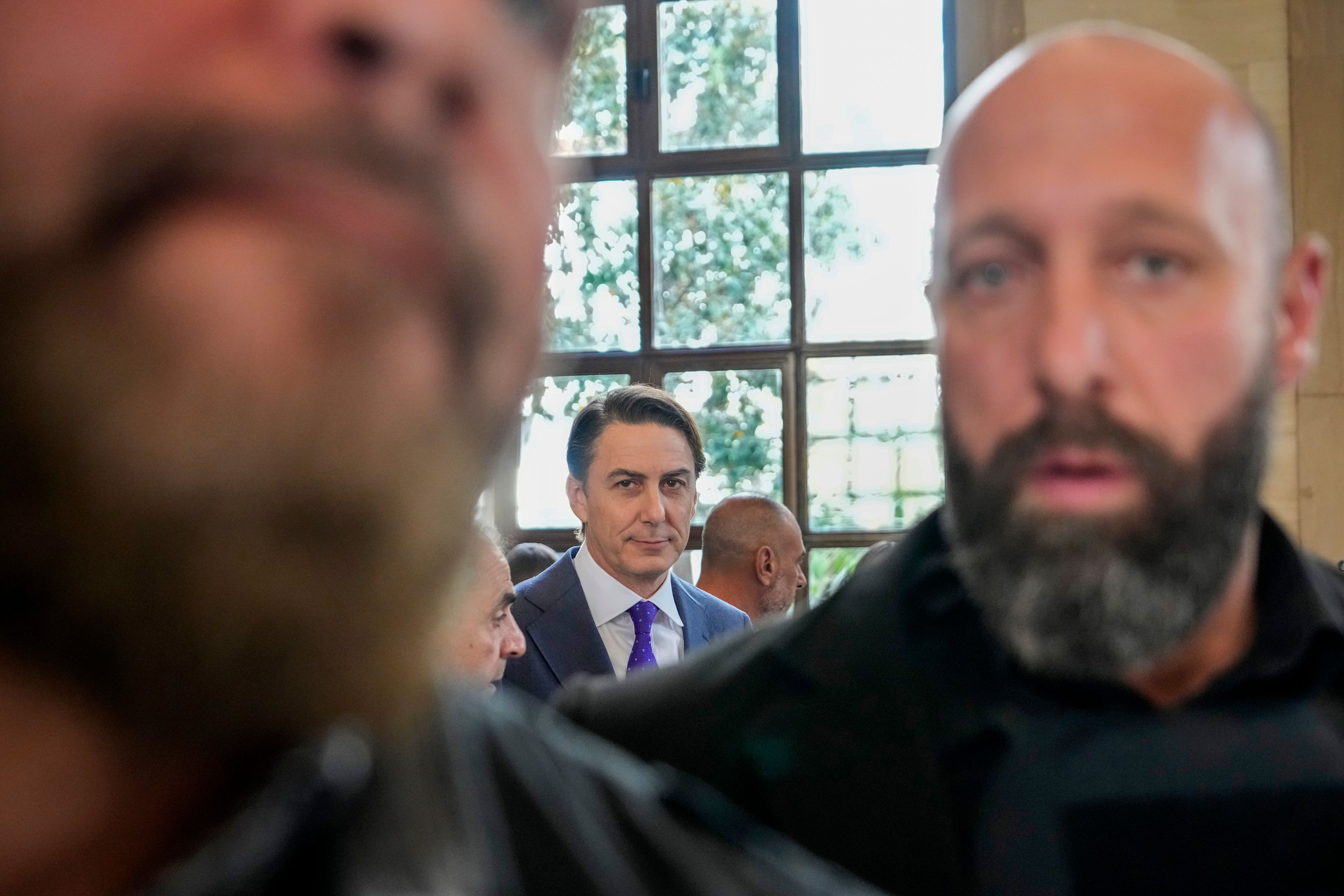 Amos Hochstein, center, a senior adviser to President Joe Biden, is escorted by bodyguards as he leaves his meeting with Parliament Speaker Nabih Berri, in Beirut, Lebanon, Tuesday, Nov. 19, 2024. (AP Photo/Hassan Ammar)