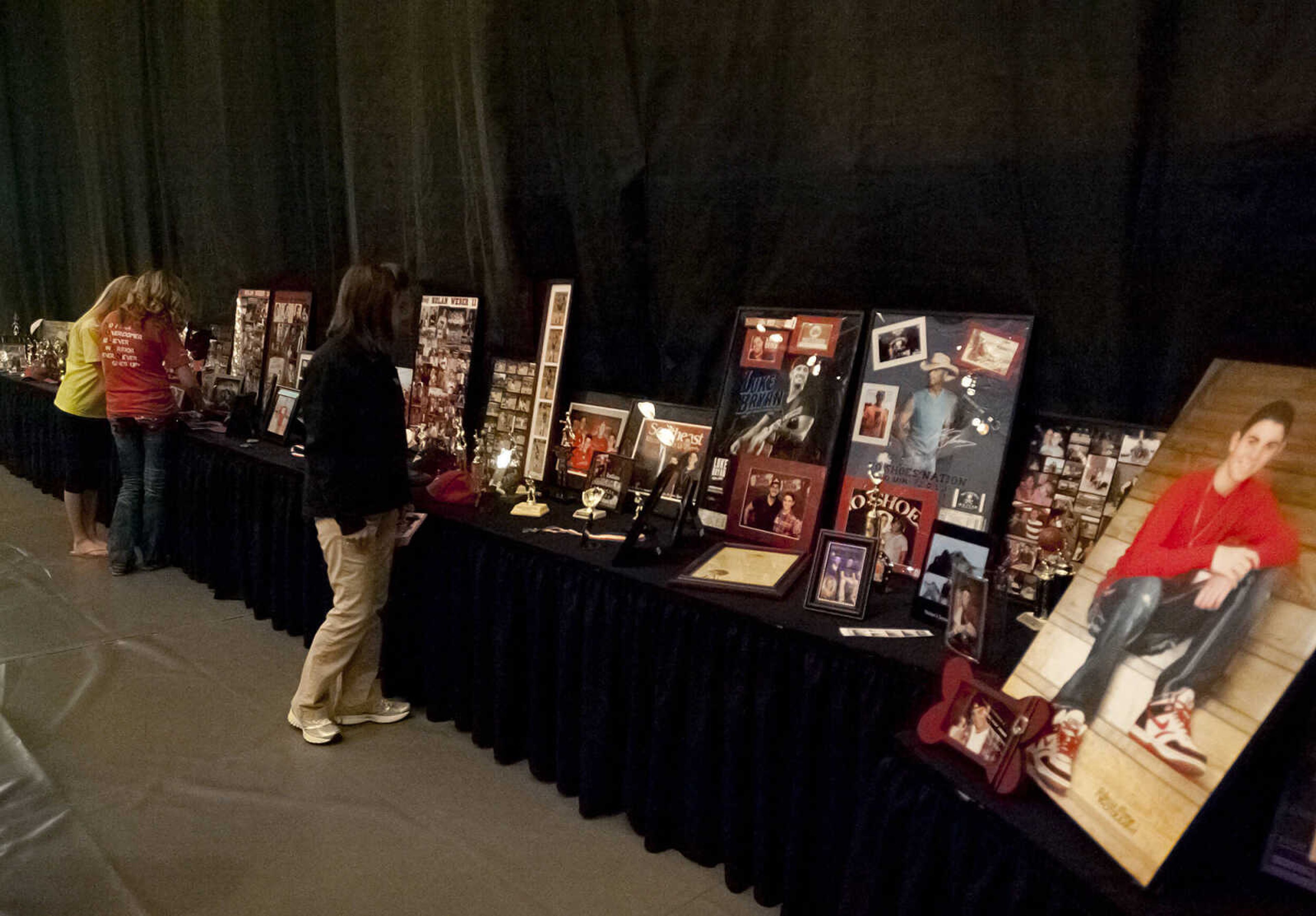 Pictures of Nolan Weber and trophies he won line a table at "Nolan Weber, Celebration of Life," Wednesday, April 30, at the Jackson High School Event Center. Friends, family and community members gathered to remember the former Jackson High School baseball and soccer player who passed away from brain cancer in December on what would have been Nolan's 19th birthday.