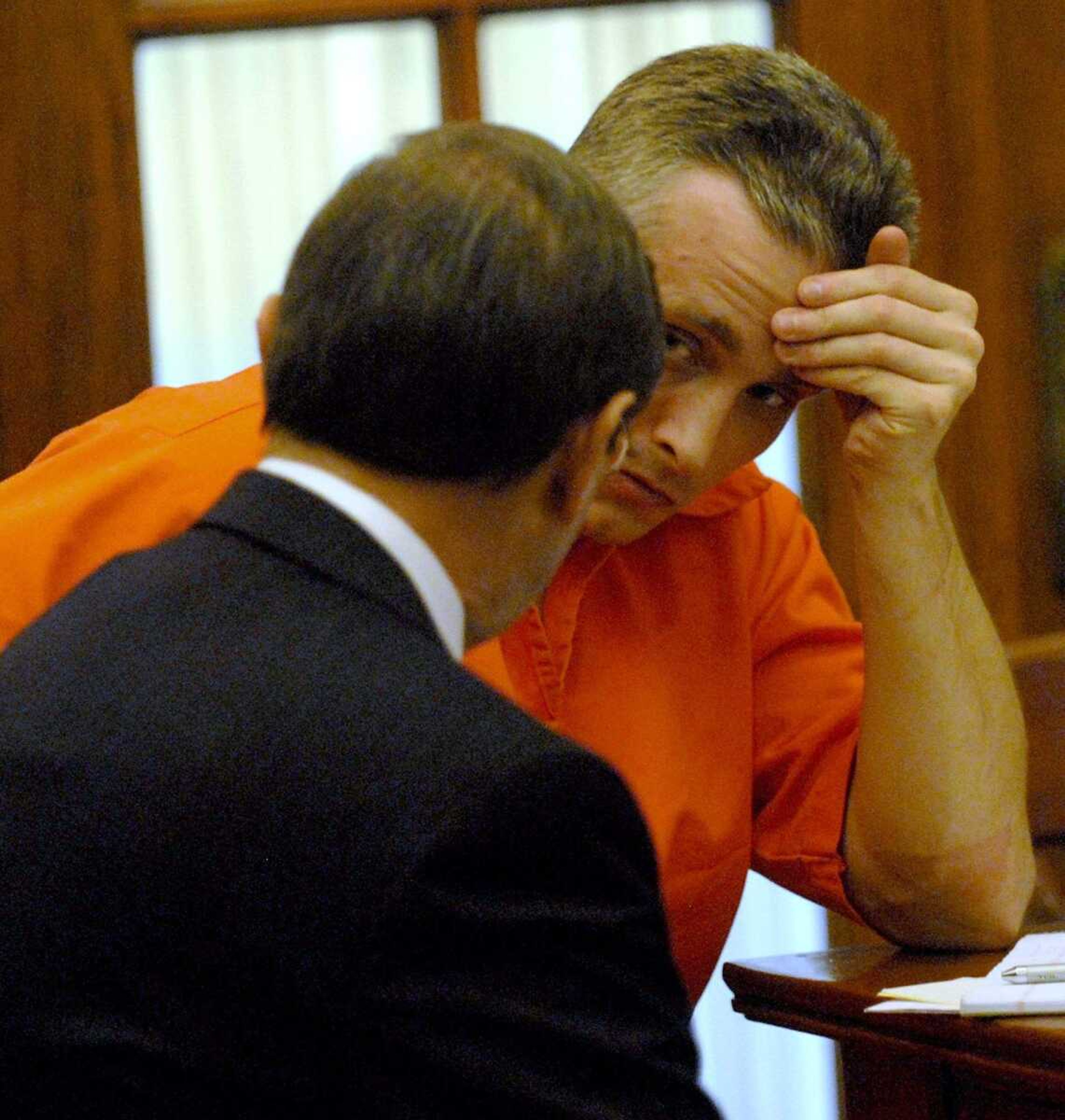 ELIZABETH DODD ~ edodd@semissourian.com
Joshua Kezer consults with his attorney Charlie Weiss on the first day of his hearing Dec. 2.