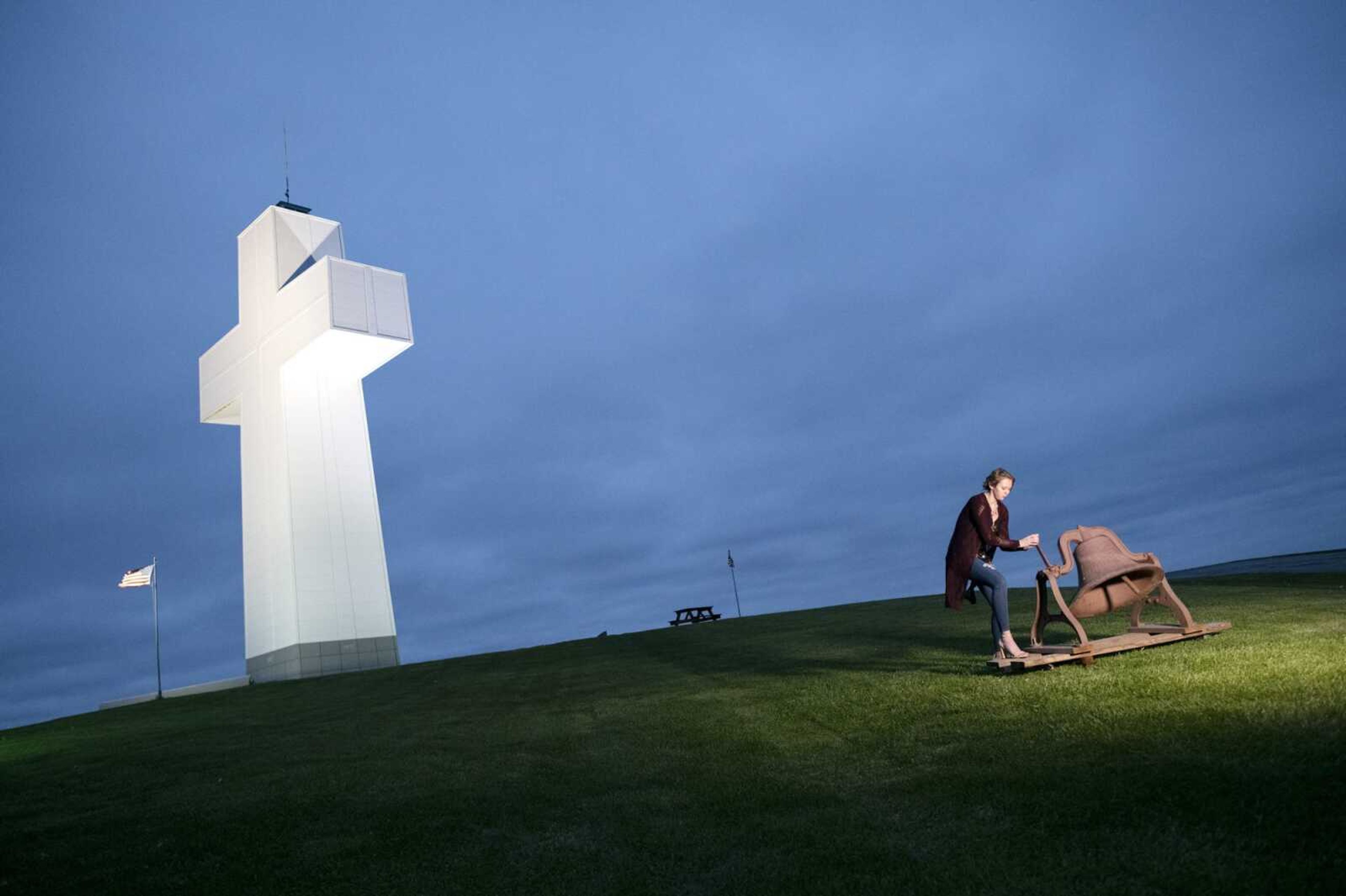 Victoria Bittle, 17, of Cobden, Illinois, rings a bell at the beginning of the Easter sunrise service Sunday, April 12, 2020, at Bald Knob Cross of Peace in Alto Pass, Illinois. Worshipers flock to the cross most years for the annual service, but not during the COVID-19 pandemic. However, there were a few people at the cross to conduct the service and share it with the masses. Teresa Gilbert, executive director of Bald Knob Cross of Peace, said WSIL-TV live streamed and broadcast the service. "It's just been an amazing experience watching everybody pull together," Gilbert said. "Not one of us could have done it by ourselves."