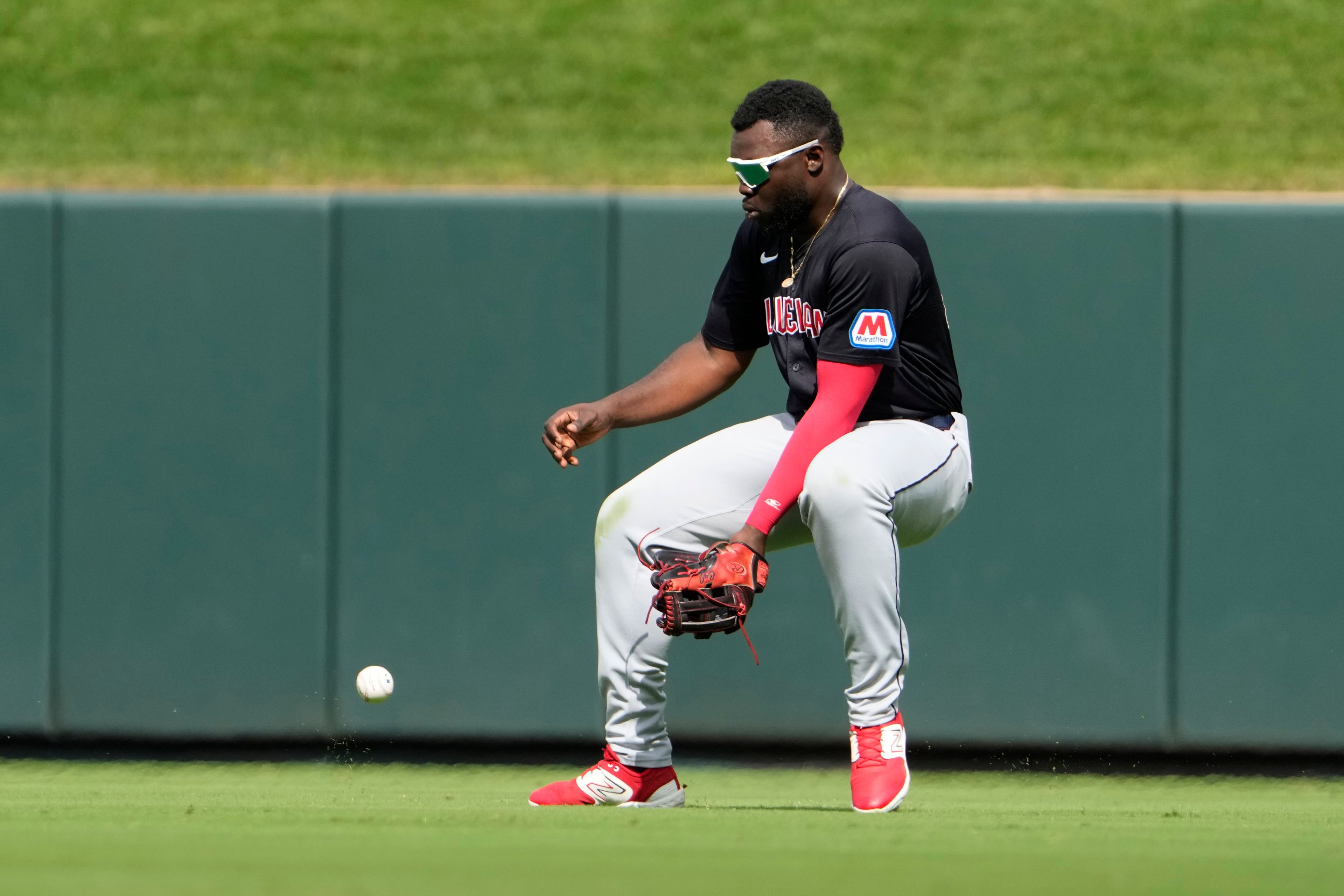 Cleveland Guardians right fielder Jhonkensy Noel reaches for an RBI single by St. Louis Cardinals' Nolan Arenado during the sixth inning of a baseball game Sunday, Sept. 22, 2024, in St. Louis. (AP Photo/Jeff Roberson)