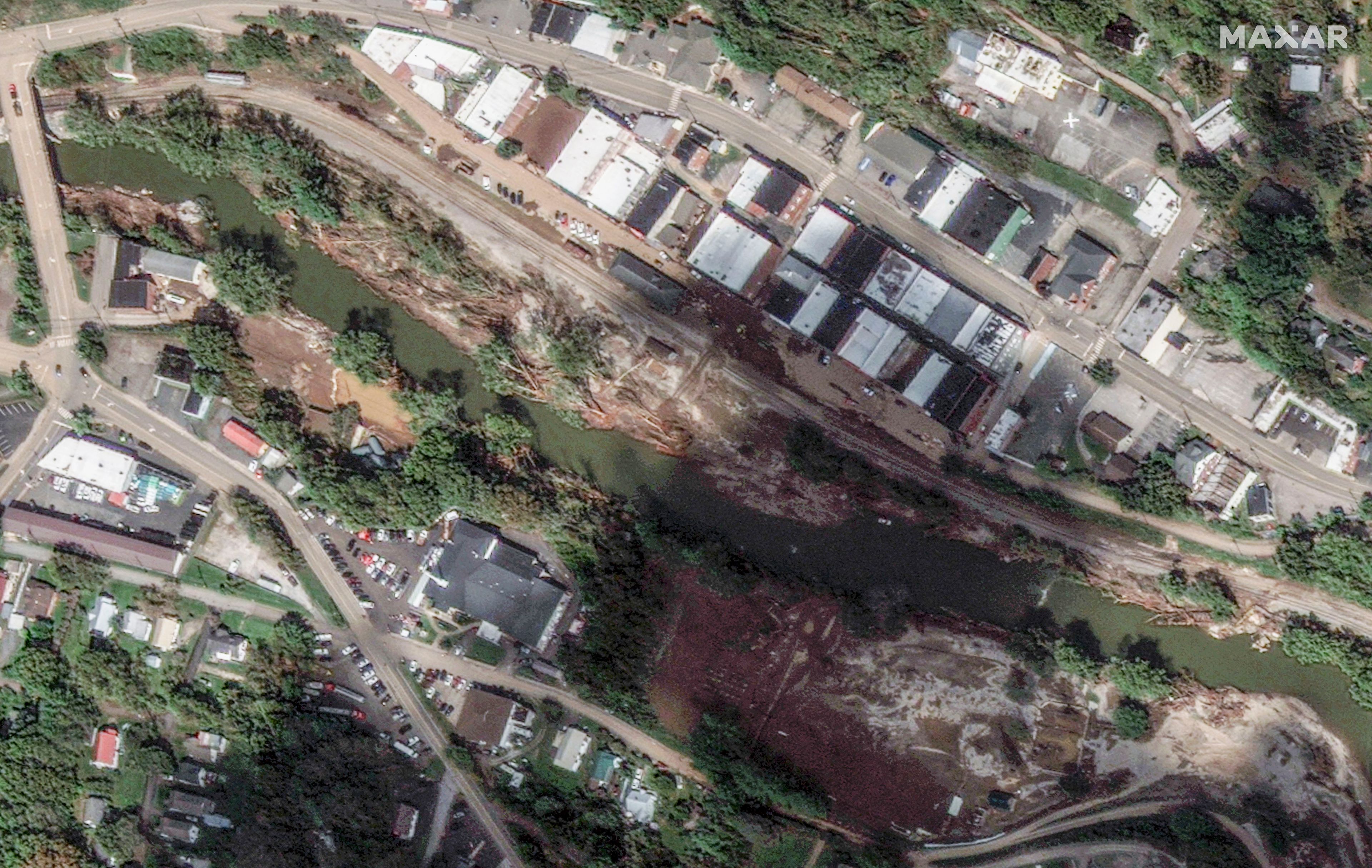 This satellite image released by Maxar Technologies shows flooding from Hurricane Helene by the North Toe River and downtown in Spruce Pine, N.C., Wednesday, Oct. 2, 2024. (Satellite image ©2024 Maxar Technologies via AP)