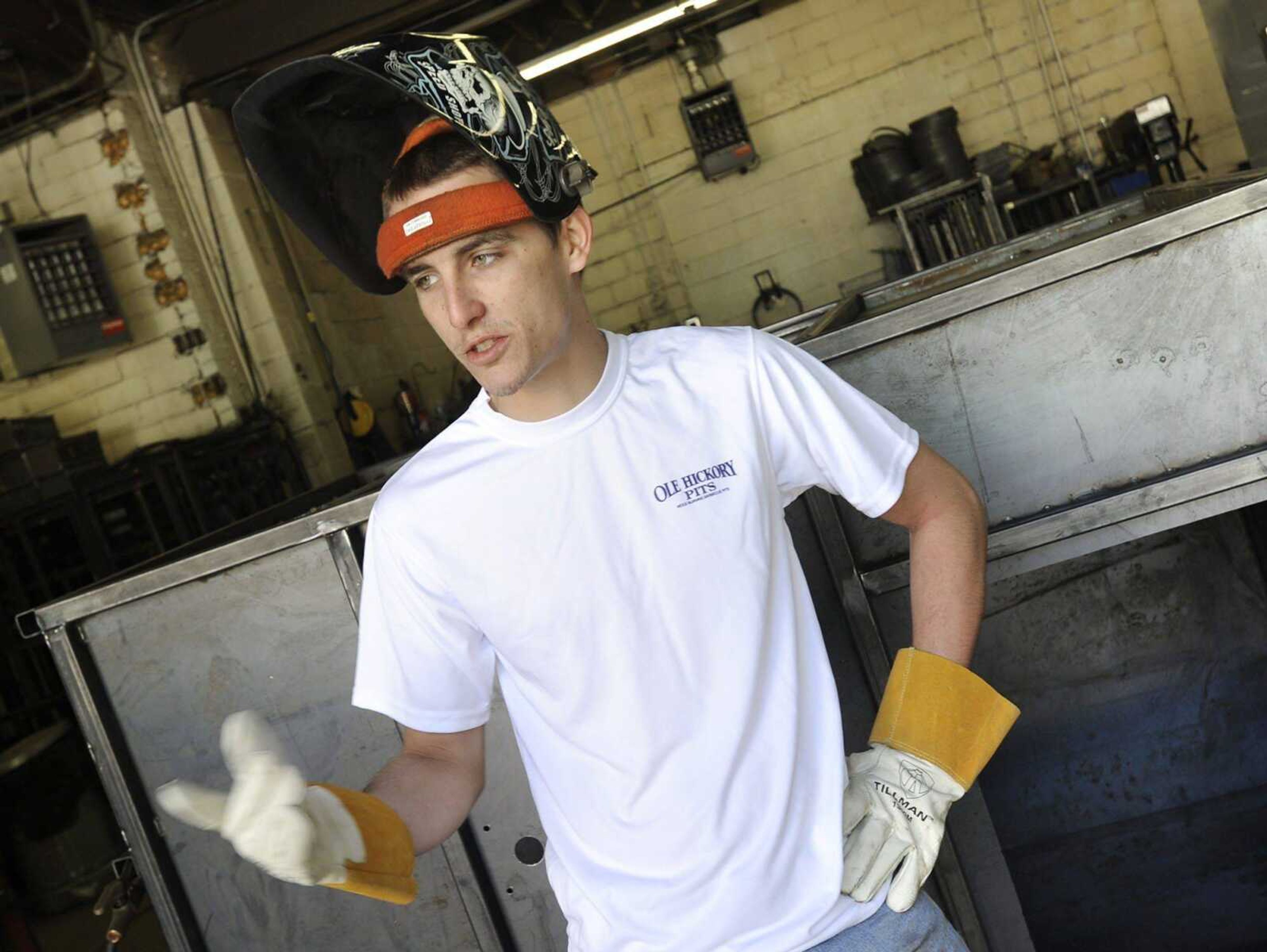 Justin Stuhr discusses his work as a welder Friday at Ole Hickory Pits in Cape Girardeau. As a veteran, he was hired through Missouri's Show-Me Heroes program. (Fred Lynch)