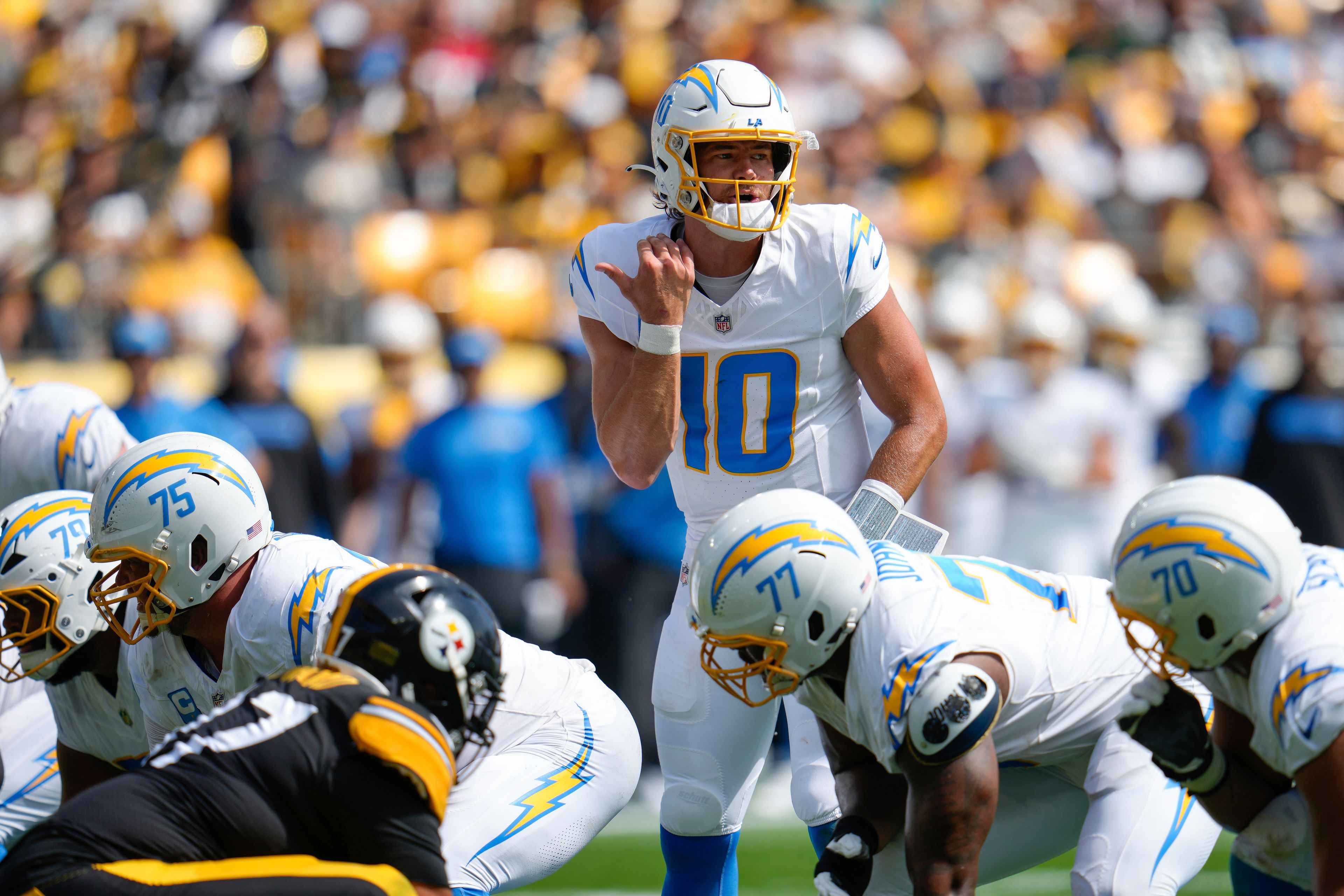 Los Angeles Chargers quarterback Justin Herbert (10) audibles at the line of scrimmage during the first half of an NFL football game against the Pittsburgh Steelers, Sunday, Sept. 22, 2024, in Pittsburgh. (AP Photo/Gene J. Puskar)