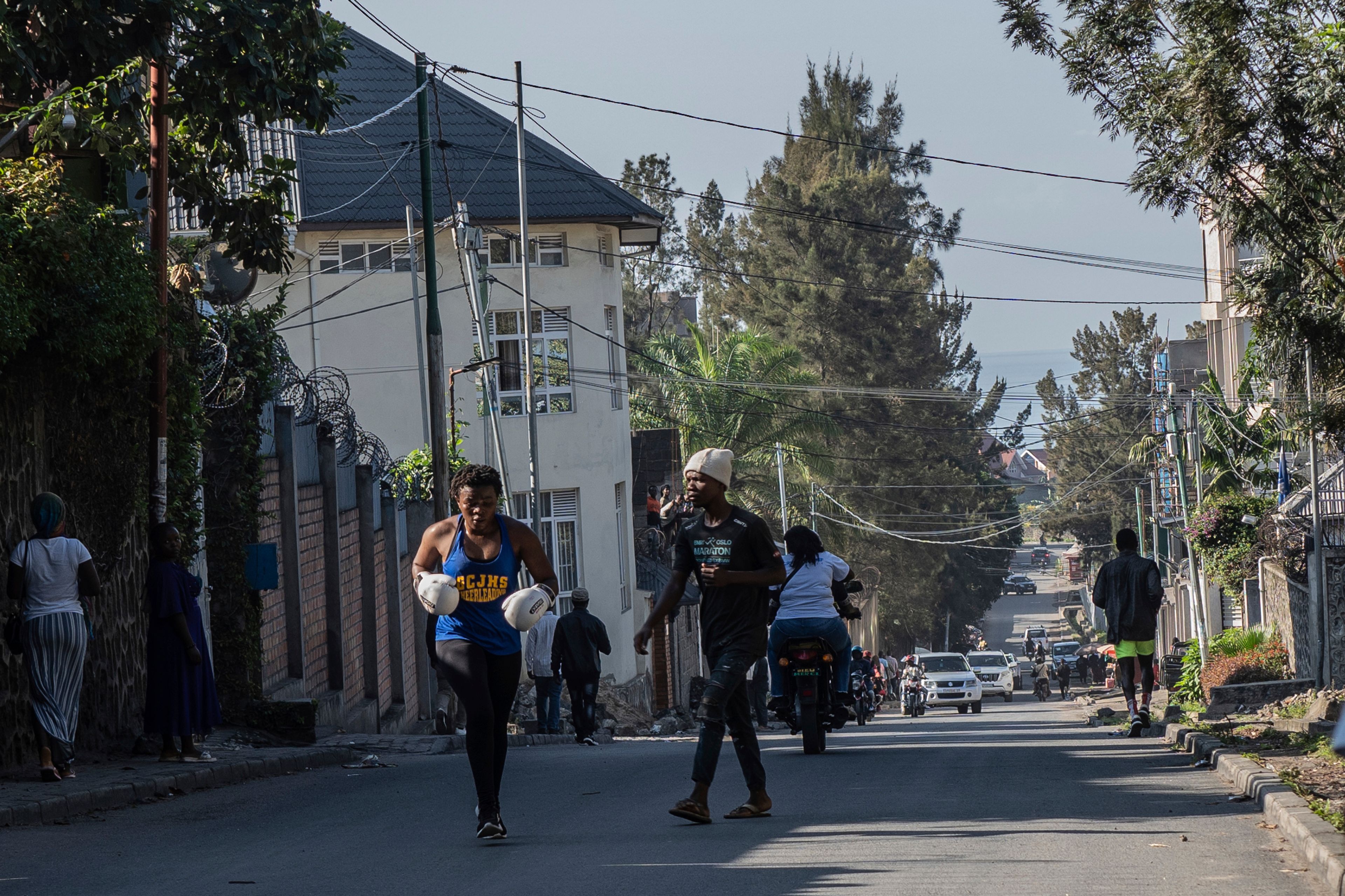 Daniella Mulekets, 20, practices Oct. 23, 2024 in the streets of Goma, Democratic republic of the Congo, prior to her first professional fight Oct. 26, on the 50th anniversary of the "Rumble in the Jungle" fight between Muhammad Ali and George Foreman in Kinshasa. (AP Photo/Moses Sawasawa)