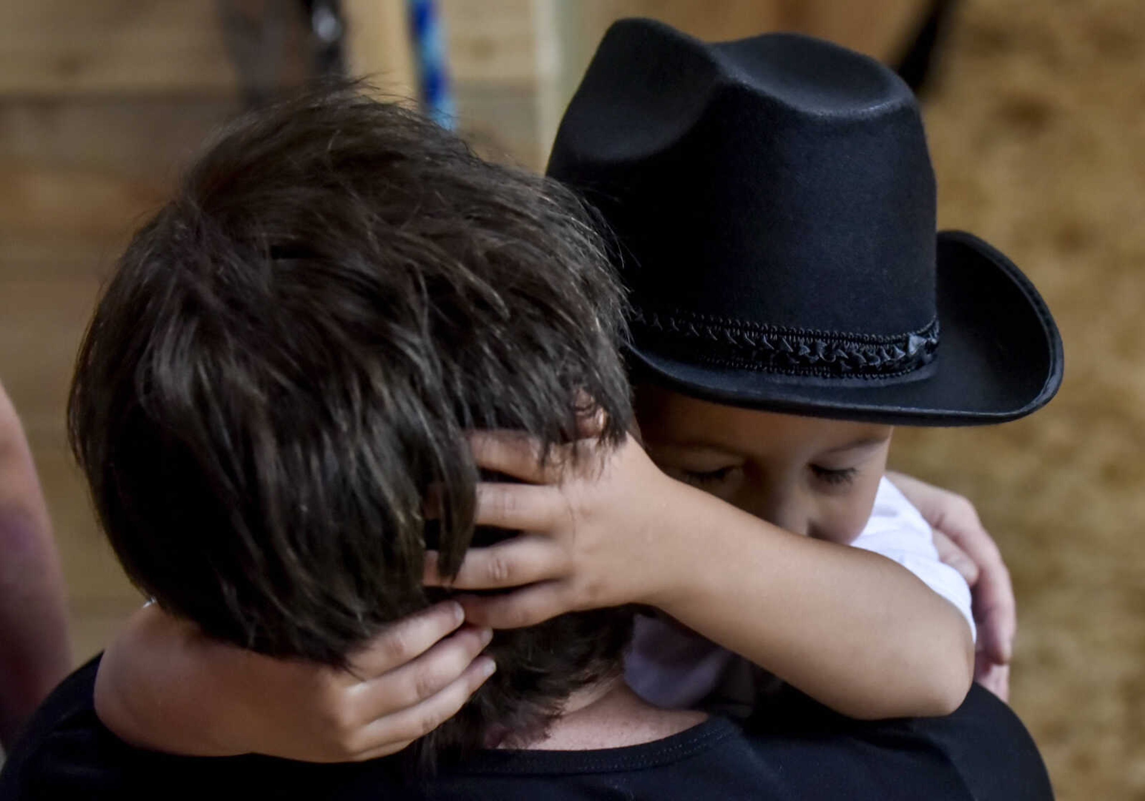 Nate Prichard, 5, hugs his mom Michelle Prichard after receiving his new horse Silver as part of his Make-A-Wish wish Monday, July 30, 2018 in&nbsp;Burfordville.