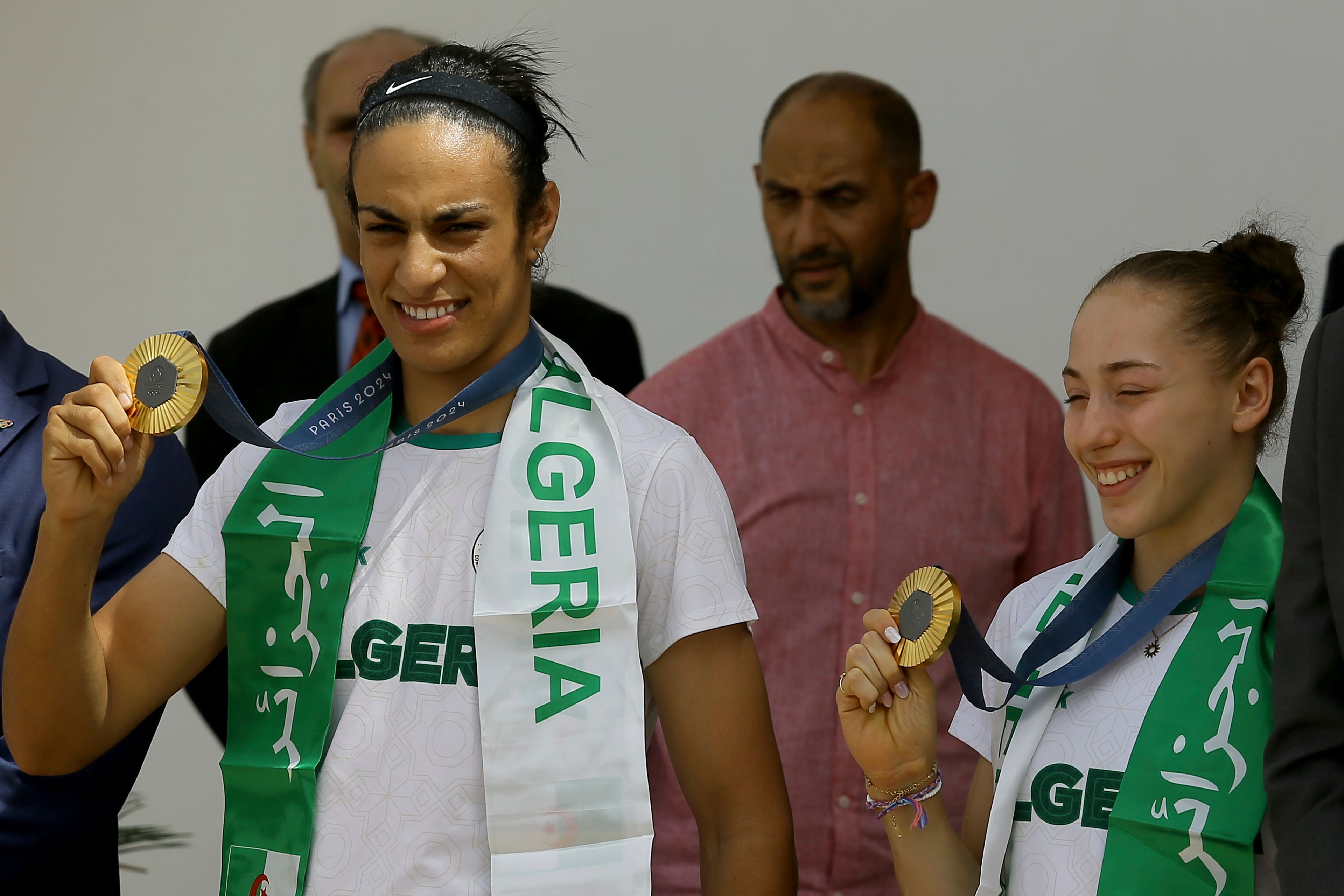 Gold medalist in the the women's 66 kg boxing Algeria's Imane Khelif, left, French-Algerian gymnast gold medalist in the uneven bars Kaylia Nemour show their medals after the 2024 Summer Olympics, Monday, Aug. 12, 2024, at Algiers airport, Algeria. (AP Photo/Anis Belghoul3