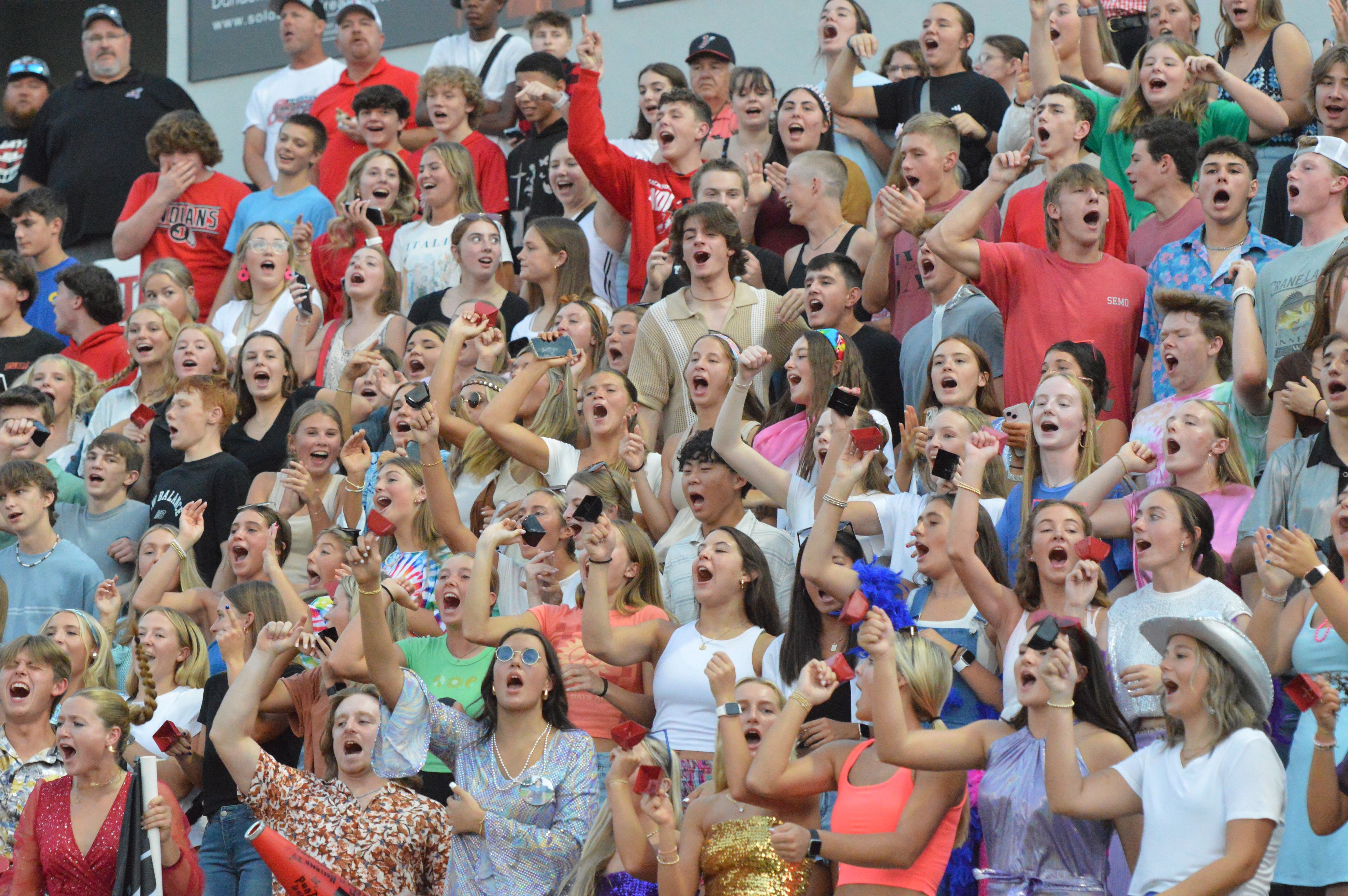 The Jackson High School student section shouts a pregame cheer in the home opener against Farmington on Friday, Sept. 20