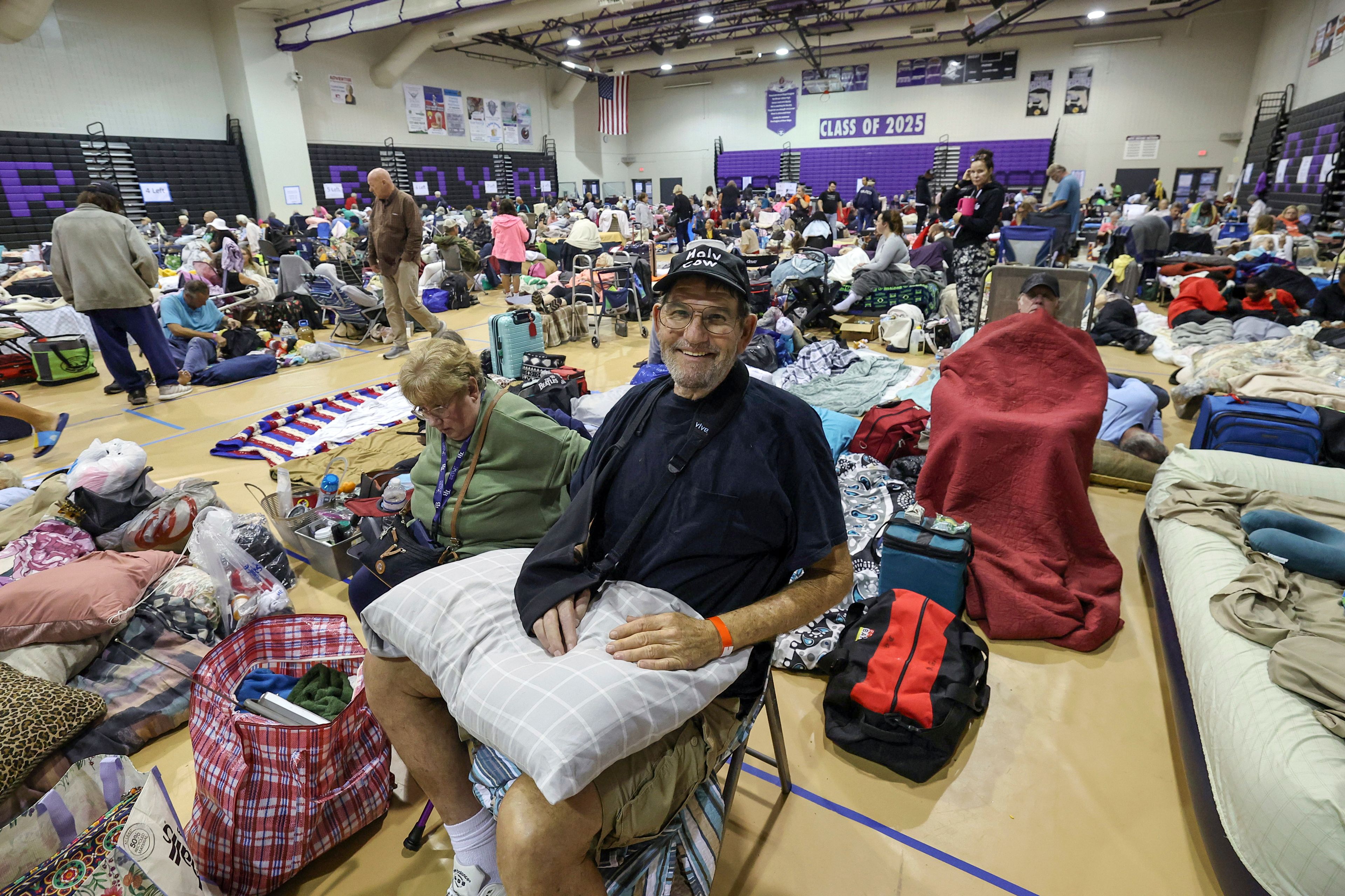 Stephen Gandy, one of 700 evacuees sheltering in the gymnasium at River Ridge Middle/High School in preparation for Hurricane Milton, smiles on Wednesday, Oct. 9, 2024, in New Port Richey, Fla. (AP Photo/Mike Carlson)