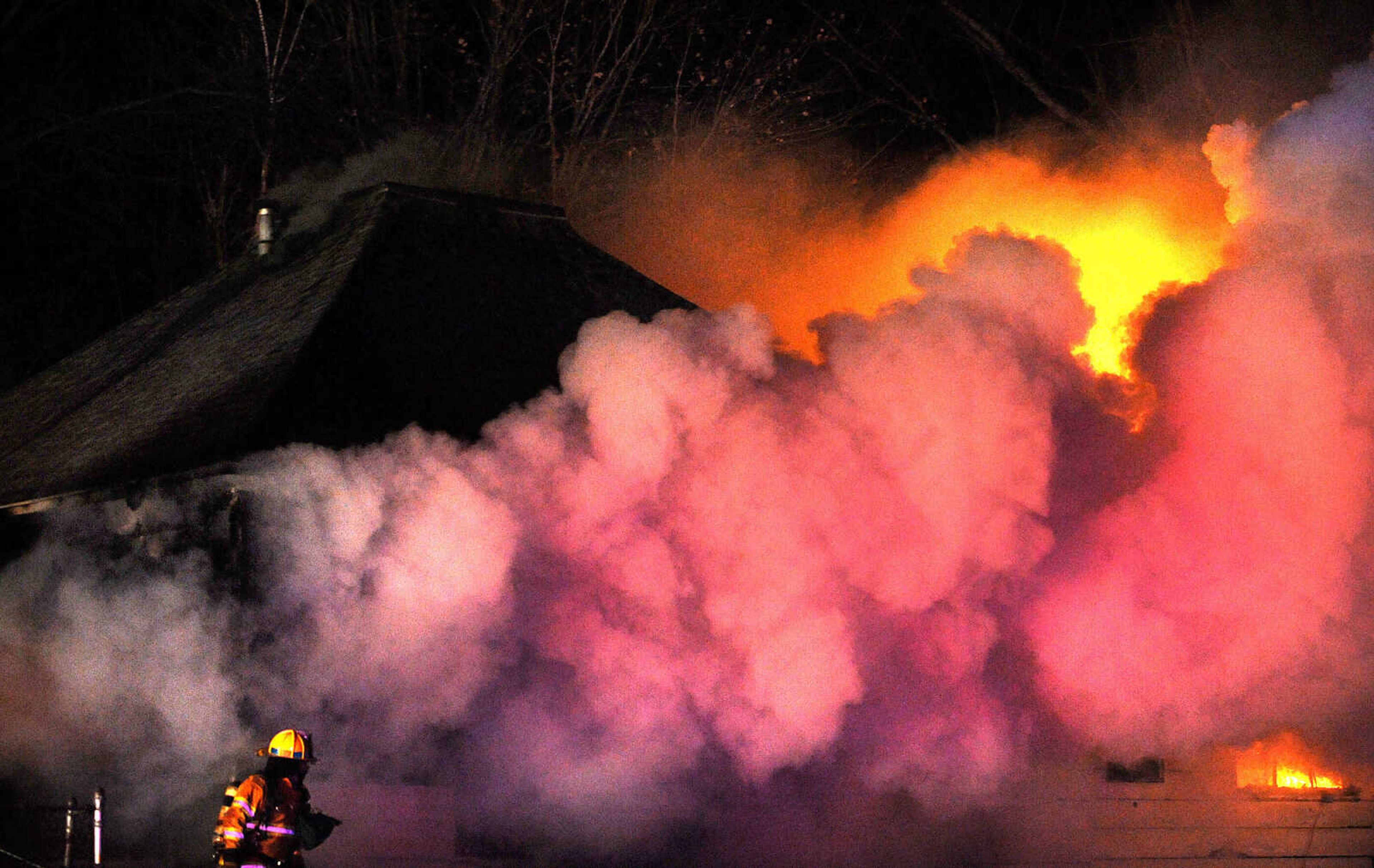 LAURA SIMON ~ lsimon@semissourian.com

Members of the Scott City and Cape Girardeau fire departments battle a blaze at 308 W. Missouri Blvd. in Scott City, Wednesday, Dec. 18, 2013. Nobody was injured in the fire.